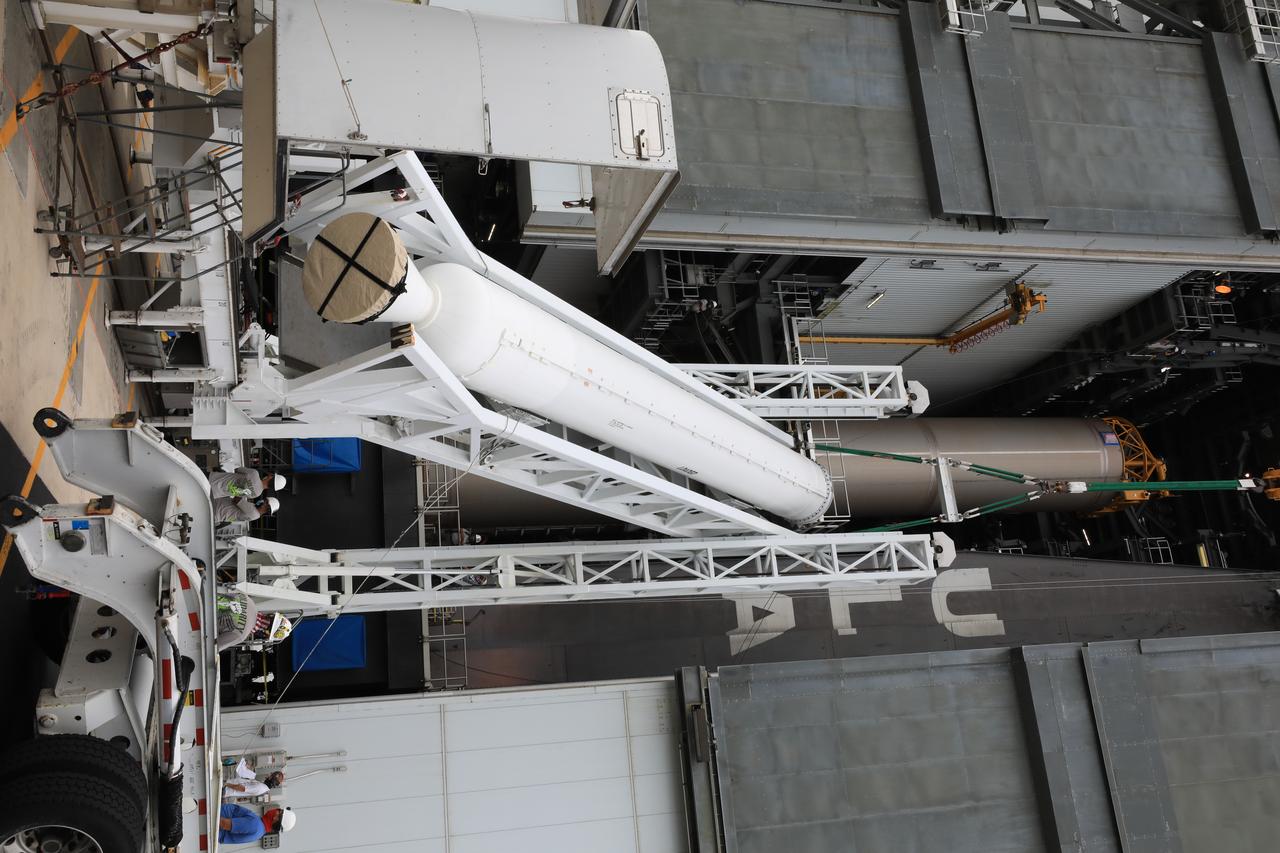 A lifting device is used to raise the second of four solid rocket boosters (SRB) for the United Launch Alliance Atlas V 541 rocket into the Vertical Integration Facility (VIF) at Space Launch Complex 41 at Cape Canaveral Air Force Station (CCAFS) in Florida on June 3, 2020. The SRB will be lifted up and mated to the Atlas V booster in the VIF. NASA’s Mars 2020 mission with the Perseverance rover is scheduled to launch on July 20, 2020, atop the Atlas V rocket from Pad 41. The rover is part of NASA’s Mars Exploration Program, a long-term effort of robotic exploration of the Red Planet. The rover’s seven instruments will search for habitable conditions in the ancient past and signs of past microbial life on Mars. The Launch Services Program at Kennedy is responsible for launch management.
