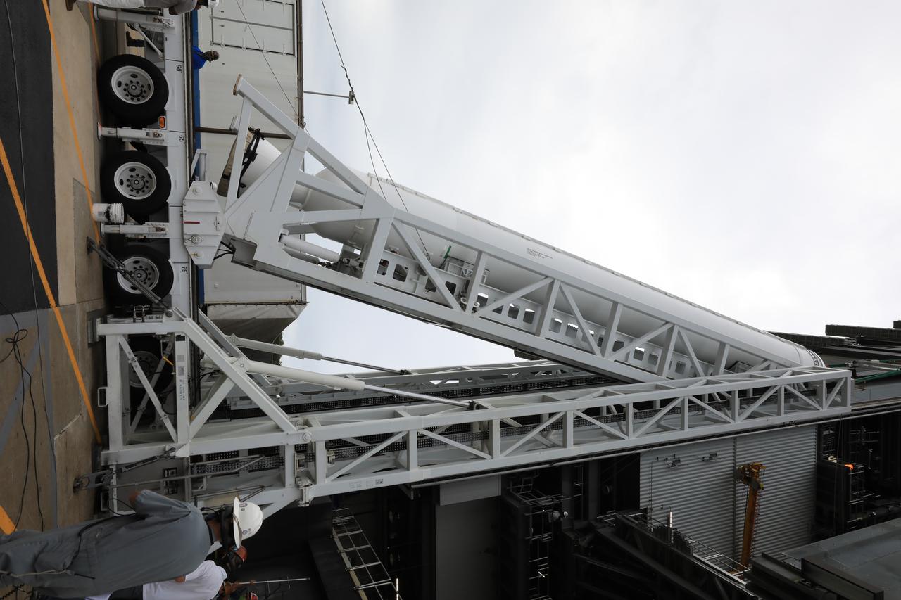 A lifting device is used to raise the second of four solid rocket boosters (SRB) for the United Launch Alliance Atlas V 541 rocket into the vertical position at the Vertical Integration Facility (VIF) at Space Launch Complex 41 at Cape Canaveral Air Force Station (CCAFS) in Florida on June 3, 2020. The SRB will be lifted up and mated to the Atlas V booster in the VIF. NASA’s Mars 2020 mission with the Perseverance rover is scheduled to launch on July 20, 2020, atop the Atlas V rocket from Pad 41. The rover is part of NASA’s Mars Exploration Program, a long-term effort of robotic exploration of the Red Planet. The rover’s seven instruments will search for habitable conditions in the ancient past and signs of past microbial life on Mars. The Launch Services Program at Kennedy is responsible for launch management.