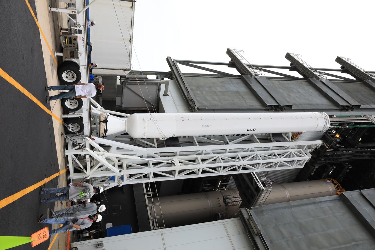A crane is attached to the second of four solid rocket boosters (SRB) for the United Launch Alliance Atlas V 541 rocket to lift it into the Vertical Integration Facility (VIF) at Space Launch Complex 41 at Cape Canaveral Air Force Station (CCAFS) in Florida on June 3, 2020. The SRB will be lifted up and mated to the Atlas V booster in the VIF. NASA’s Mars 2020 mission with the Perseverance rover is scheduled to launch on July 20, 2020, atop the Atlas V rocket from Pad 41. The rover is part of NASA’s Mars Exploration Program, a long-term effort of robotic exploration of the Red Planet. The rover’s seven instruments will search for habitable conditions in the ancient past and signs of past microbial life on Mars. The Launch Services Program at Kennedy is responsible for launch management.