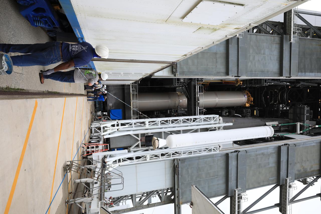 A crane is used to lift the second of four solid rocket boosters (SRB) for the United Launch Alliance Atlas V 541 rocket into the Vertical Integration Facility (VIF) at Space Launch Complex 41 at Cape Canaveral Air Force Station (CCAFS) in Florida on June 3, 2020. The SRB will be lifted up and mated to the Atlas V booster in the VIF. NASA’s Mars 2020 mission with the Perseverance rover is scheduled to launch on July 20, 2020, atop the Atlas V rocket from Pad 41. The rover is part of NASA’s Mars Exploration Program, a long-term effort of robotic exploration of the Red Planet. The rover’s seven instruments will search for habitable conditions in the ancient past and signs of past microbial life on Mars. The Launch Services Program at Kennedy is responsible for launch management.