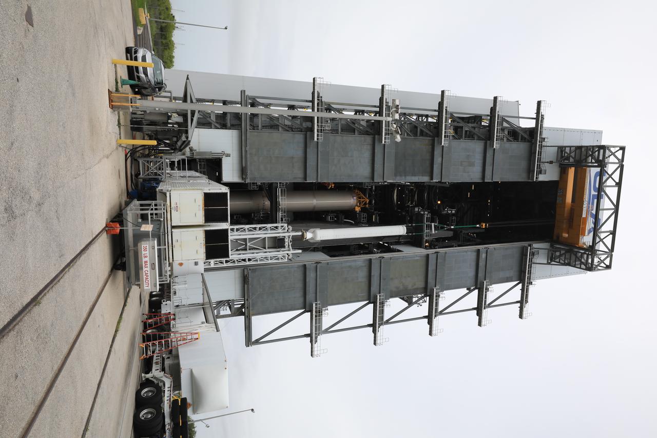 A crane is used to lift the second of four solid rocket boosters (SRB) for the United Launch Alliance Atlas V 541 rocket into the Vertical Integration Facility (VIF) at Space Launch Complex 41 at Cape Canaveral Air Force Station (CCAFS) in Florida on June 3, 2020. The SRB will be lifted up and mated to the Atlas V booster in the VIF. NASA’s Mars 2020 mission with the Perseverance rover is scheduled to launch on July 20, 2020, atop the Atlas V rocket from Pad 41. The rover is part of NASA’s Mars Exploration Program, a long-term effort of robotic exploration of the Red Planet. The rover’s seven instruments will search for habitable conditions in the ancient past and signs of past microbial life on Mars. The Launch Services Program at Kennedy is responsible for launch management.