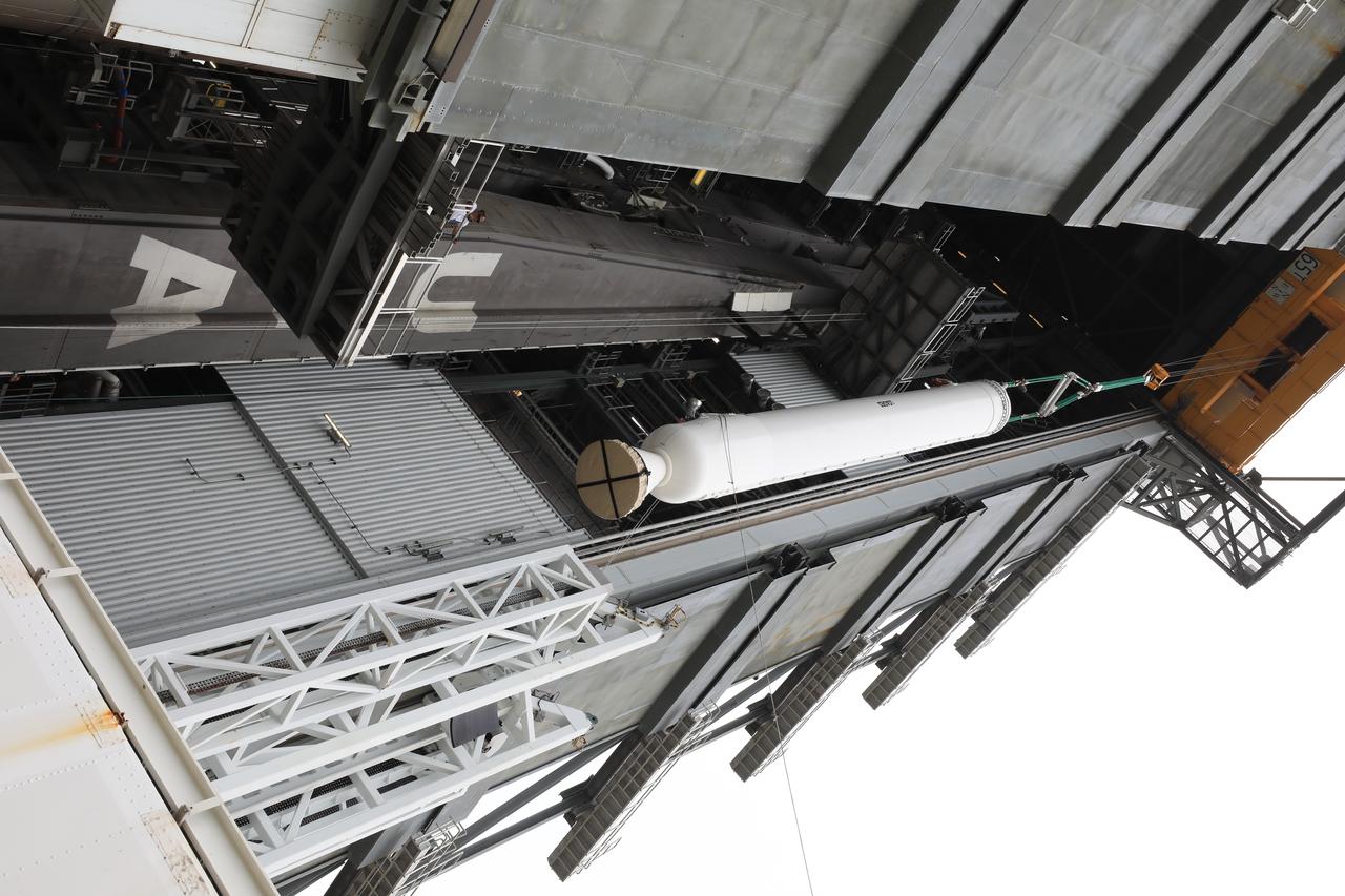 A crane is used to lift the second of four solid rocket boosters (SRB) for the United Launch Alliance Atlas V 541 rocket into the Vertical Integration Facility (VIF) at Space Launch Complex 41 at Cape Canaveral Air Force Station (CCAFS) in Florida on June 3, 2020. The SRB will be lifted up and mated to the Atlas V booster in the VIF. NASA’s Mars 2020 mission with the Perseverance rover is scheduled to launch on July 20, 2020, atop the Atlas V rocket from Pad 41. The rover is part of NASA’s Mars Exploration Program, a long-term effort of robotic exploration of the Red Planet. The rover’s seven instruments will search for habitable conditions in the ancient past and signs of past microbial life on Mars. The Launch Services Program at Kennedy is responsible for launch management.