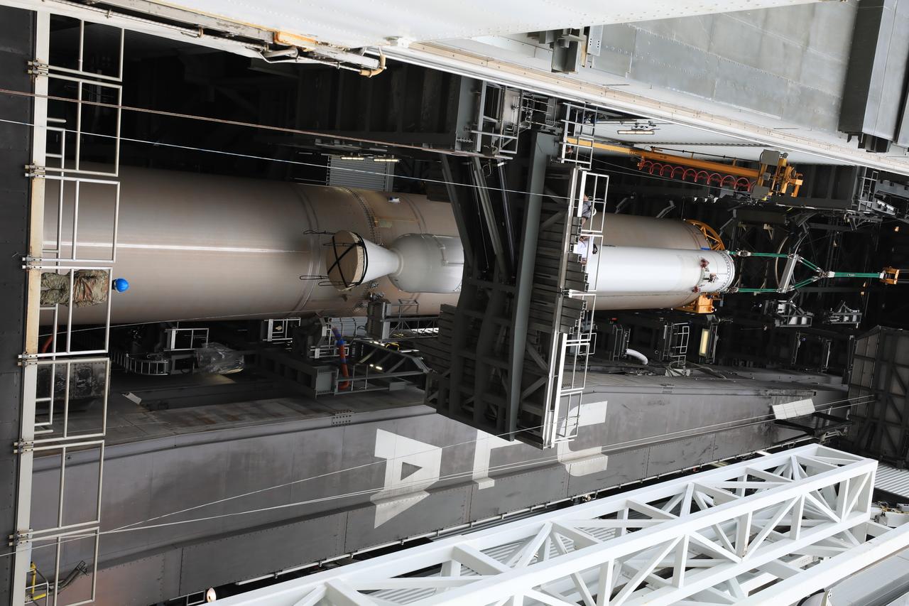 Inside the Vertical Integration Facility at Space Launch Complex 41 at Cape Canaveral Air Force Station in Florida, the second of four solid rocket boosters (SRB) for the United Launch Alliance Atlas V 541 rocket is lifted up by crane on June 3, 2020. The SRB will be mated to the Atlas V booster. NASA’s Mars 2020 mission with the Perseverance rover is scheduled to launch on July 20, 2020, atop the Atlas V rocket from Pad 41. The rover is part of NASA’s Mars Exploration Program, a long-term effort of robotic exploration of the Red Planet. The rover’s seven instruments will search for habitable conditions in the ancient past and signs of past microbial life on Mars. The Launch Services Program at Kennedy is responsible for launch management.