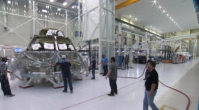 Inside the Neil Armstrong Operations and Checkout Building high bay at NASA’s Kennedy Space Center in Florida, the Artemis II crew module is relocated into a clean room on June 10, 2020. Workers will perform tube welds of the propulsion system and the Environmental Control & Life Support Systems. Artemis II is the first crewed mission in a series of missions to the Moon and on to Mars. Artemis II will confirm all of the Orion spacecraft’s systems operate as designed in the actual environment of deep space with astronauts aboard. As part of the Artemis Program, NASA will send the first woman and next man to the Moon by 2024.