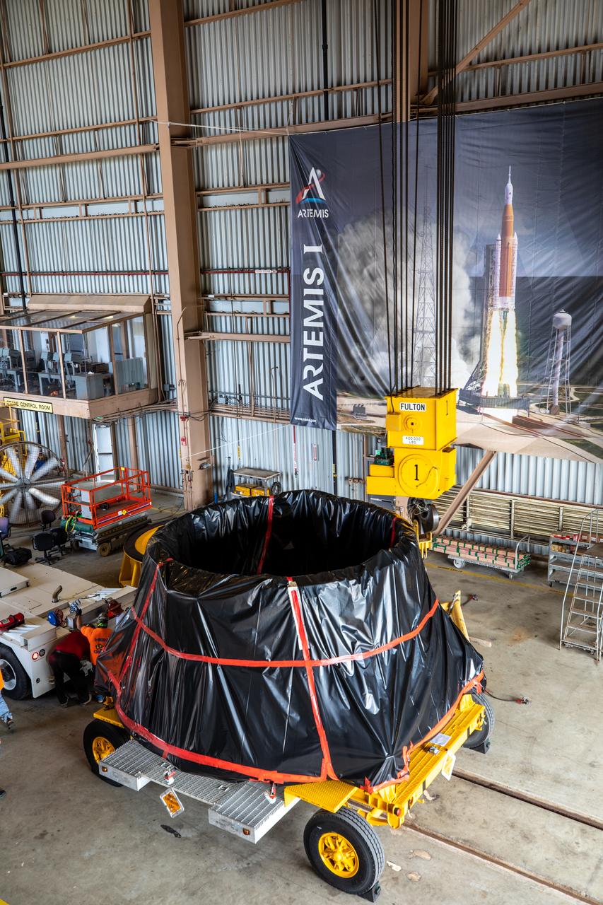 The first of two Artemis I aft skirts for NASA's Space Launch System (SLS) rocket’s twin solid rocket boosters is moved into the Rotation Processing and Surge Facility (RPSF) at the agency’s Kennedy Space Center in Florida on June 10, 2020. The aft skirts were refurbished by Northrop Grumman. They house the thrust vector control system, which controls 70 percent of the steering during initial ascent of the SLS rocket. The segments will remain in the RPSF until ready for stacking with the forward and aft parts of the boosters on the mobile launcher in High Bay 3 of the Vehicle Assembly Building. Through the Artemis Program, NASA is working to land the first woman and next man on the Moon by 2024.