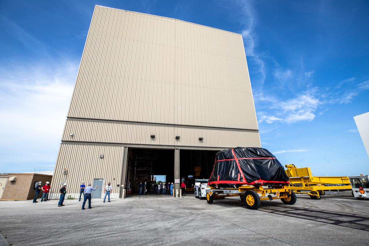The first of two Artemis I aft skirts for NASA’s Space Launch System (SLS) rocket’s twin solid rocket boosters arrives at the Rotation, Processing and Surge Facility (RPSF) at the agency’s Kennedy Space Center in Florida on June 10, 2020. They were transported from the Booster Fabrication Facility. The aft skirts were refurbished by Northrop Grumman. They house the thrust vector control system, which controls 70 percent of the steering during initial ascent of the SLS rocket. The segments will remain in the RPSF until ready for stacking with the forward and aft parts of the boosters on the mobile launcher in High Bay 3 of the Vehicle Assembly Building. Through the Artemis Program, NASA is working to land the first woman and next man on the Moon by 2024.