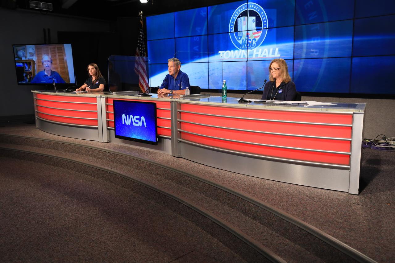 Members of NASA Kennedy Space Center leadership hold a virtual town hall at the Florida spaceport’s Press Site auditorium on June 10, 2020, to share the plan for employees to safely return to on-site work during the time of COVID-19. From left to right are Dr. David Tipton, Kennedy’s Chief Medical Officer (participating via monitor), event moderator Marie Lewis of NASA Communications, Center Director Bob Cabana and Deputy Director Janet Petro.