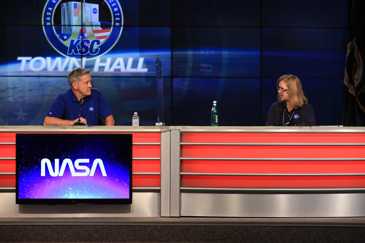 Kennedy Space Center Director Bob Cabana, left, and Deputy Director Janet Petro converse while participating in a virtual town hall at the Florida spaceport’s Press Site auditorium on June 10, 2020, to share the plan for employees to safely return to on-site work during the time of COVID-19. Also participating was Dr. David Tipton, chief medical officer, not pictured.