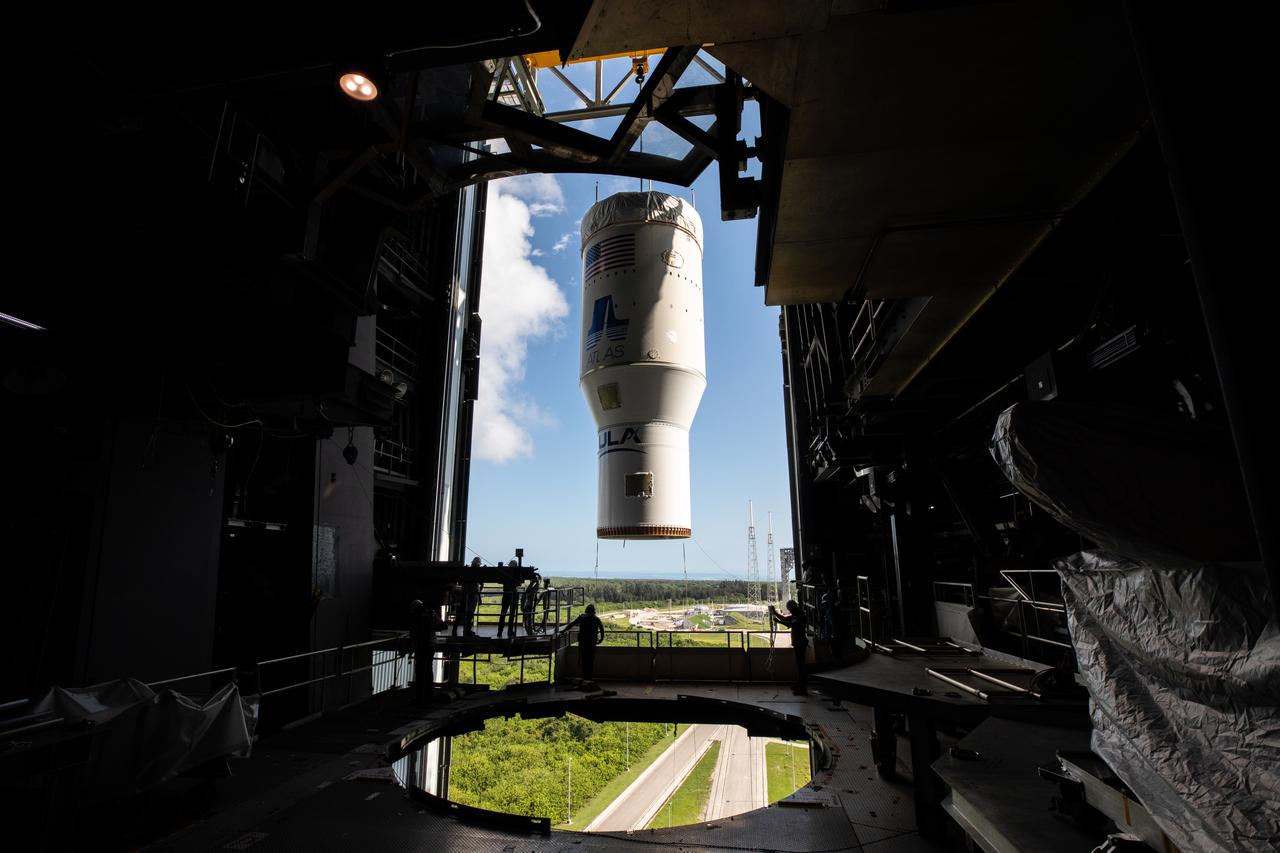 A view from inside the Vertical Integration Facility at Space Launch Complex 41 at Cape Canaveral Air Force Station in Florida, as the single-engine Centaur upper stage is lifted up for mating to the United Launch Alliance Atlas V rocket for NASA’s Mars Perseverance rover on June 10, 2020. The Centaur will be attached to the rocket’s first stage. The Mars Perseverance rover is scheduled to launch atop the Atlas V 541 rocket from Pad 41 on July 20, 2020. The rover is part of NASA’s Mars Exploration Program, a long-term effort of robotic exploration of the Red Planet. The rover’s seven instruments will search for habitable conditions in the ancient past and signs of past microbial life on Mars. The Launch Services Program at Kennedy is responsible for launch management.