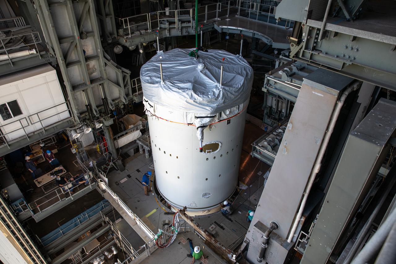 Inside the Vertical Integration Facility at Space Launch Complex 41 at Cape Canaveral Air Force Station in Florida, a crane lowers the single-engine Centaur upper stage for mating to the United Launch Alliance Atlas V rocket on June 10, 2020. NASA’s Mars Perseverance rover is scheduled to launch atop the Atlas V 541 rocket from Pad 41 on July 20, 2020. The rover is part of NASA’s Mars Exploration Program, a long-term effort of robotic exploration of the Red Planet. The rover’s seven instruments will search for habitable conditions in the ancient past and signs of past microbial life on Mars. The Launch Services Program at Kennedy is responsible for launch management.