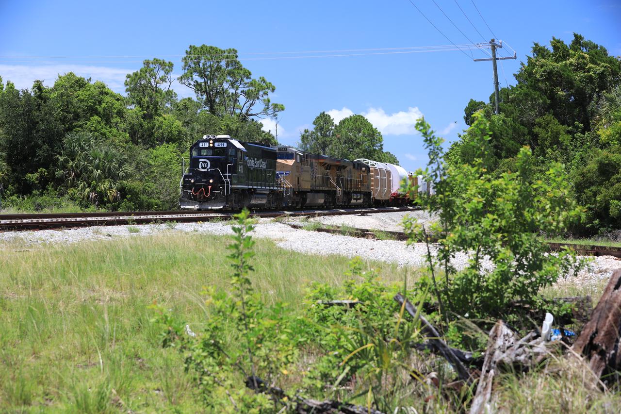 The train carrying the two solid rocket boosters that will power NASA’s Space Launch System (SLS) for Artemis missions to the Moon arrives at the Jay Jay rail yard – the connecting link between Kennedy Space Center and the Florida East Coast railway – in Titusville, Florida, on June 12, 2020. The boosters, each comprised of five motor segments, traveled from a Northrop Grumman manufacturing facility in Promontory, Utah, to Kennedy’s Rotation, Processing and Surge Facility, where teams with NASA’s Exploration Ground Systems will process the segments before moving them to the Vehicle Assembly Building for stacking on the mobile launcher. Under the Artemis program, NASA will land the first woman and the next man on the Moon by 2024. The first in a series of increasingly complex missions, Artemis I will test the Orion spacecraft and SLS as an integrated system ahead of crewed flights to the Moon.  