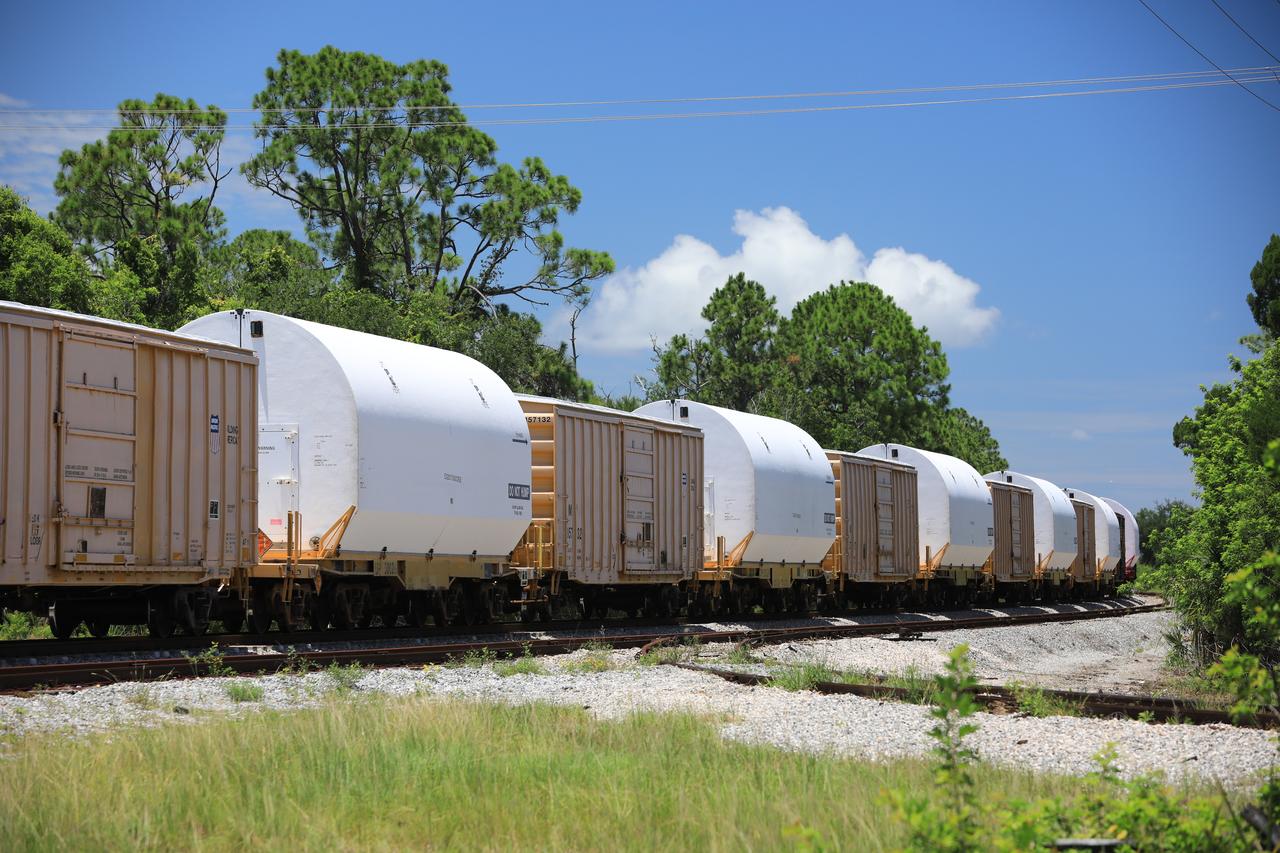 The train carrying the two solid rocket boosters that will power NASA’s Space Launch System (SLS) for Artemis missions to the Moon arrives at the Jay Jay rail yard – the connecting link between Kennedy Space Center and the Florida East Coast railway – in Titusville, Florida, on June 12, 2020. The boosters, each comprised of five motor segments, traveled from a Northrop Grumman manufacturing facility in Promontory, Utah, to Kennedy’s Rotation, Processing and Surge Facility, where teams with NASA’s Exploration Ground Systems will process the segments before moving them to the Vehicle Assembly Building for stacking on the mobile launcher. Under the Artemis program, NASA will land the first woman and the next man on the Moon by 2024. The first in a series of increasingly complex missions, Artemis I will test the Orion spacecraft and SLS as an integrated system ahead of crewed flights to the Moon. 