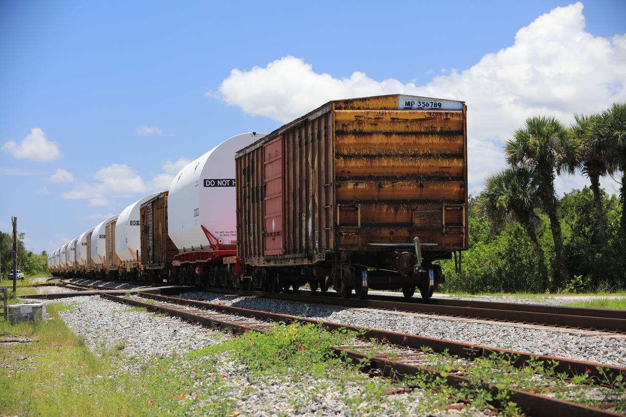 The train carrying the two solid rocket boosters that will power NASA’s Space Launch System (SLS) for Artemis missions to the Moon arrives at the Jay Jay rail yard – the connecting link between Kennedy Space Center and the Florida East Coast railway – in Titusville, Florida, on June 12, 2020. The boosters, each comprised of five motor segments, traveled from a Northrop Grumman manufacturing facility in Promontory, Utah, to Kennedy’s Rotation, Processing and Surge Facility, where teams with NASA’s Exploration Ground Systems will process the segments before moving them to the Vehicle Assembly Building for stacking on the mobile launcher. Under the Artemis program, NASA will land the first woman and the next man on the Moon by 2024. The first in a series of increasingly complex missions, Artemis I will test the Orion spacecraft and SLS as an integrated system ahead of crewed flights to the Moon.  