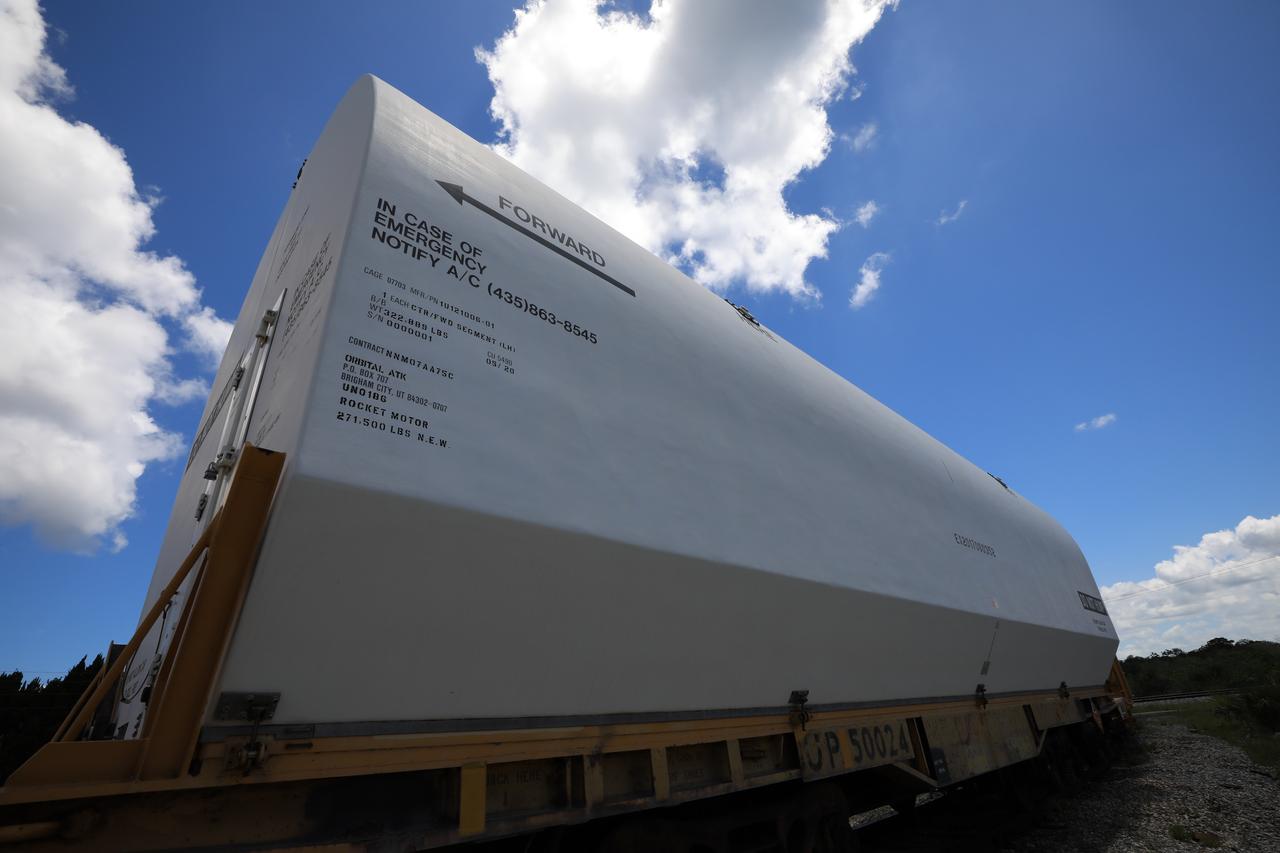 The train carrying the two solid rocket boosters that will power NASA’s Space Launch System (SLS) for Artemis missions to the Moon arrives at the Jay Jay rail yard – the connecting link between Kennedy Space Center and the Florida East Coast railway – in Titusville, Florida, on June 12, 2020. The boosters, each comprised of five motor segments, traveled from a Northrop Grumman manufacturing facility in Promontory, Utah, to Kennedy’s Rotation, Processing and Surge Facility, where teams with NASA’s Exploration Ground Systems will process the segments before moving them to the Vehicle Assembly Building for stacking on the mobile launcher. Under the Artemis program, NASA will land the first woman and the next man on the Moon by 2024. The first in a series of increasingly complex missions, Artemis I will test the Orion spacecraft and SLS as an integrated system ahead of crewed flights to the Moon.  