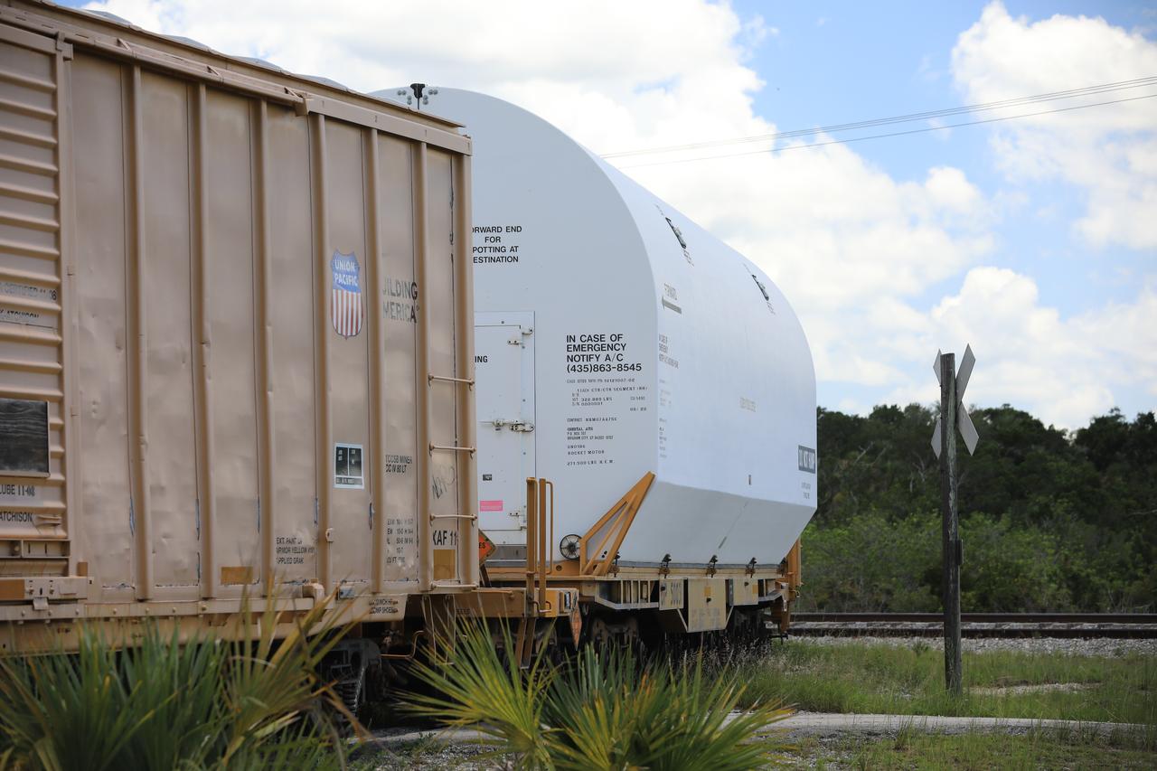 The train carrying the two solid rocket boosters that will power NASA’s Space Launch System (SLS) for Artemis missions to the Moon arrives at the Jay Jay rail yard – the connecting link between Kennedy Space Center and the Florida East Coast railway – in Titusville, Florida, on June 12, 2020. The boosters, each comprised of five motor segments, traveled from a Northrop Grumman manufacturing facility in Promontory, Utah, to Kennedy’s Rotation, Processing and Surge Facility, where teams with NASA’s Exploration Ground Systems will process the segments before moving them to the Vehicle Assembly Building for stacking on the mobile launcher. Under the Artemis program, NASA will land the first woman and the next man on the Moon by 2024. The first in a series of increasingly complex missions, Artemis I will test the Orion spacecraft and SLS as an integrated system ahead of crewed flights to the Moon.  