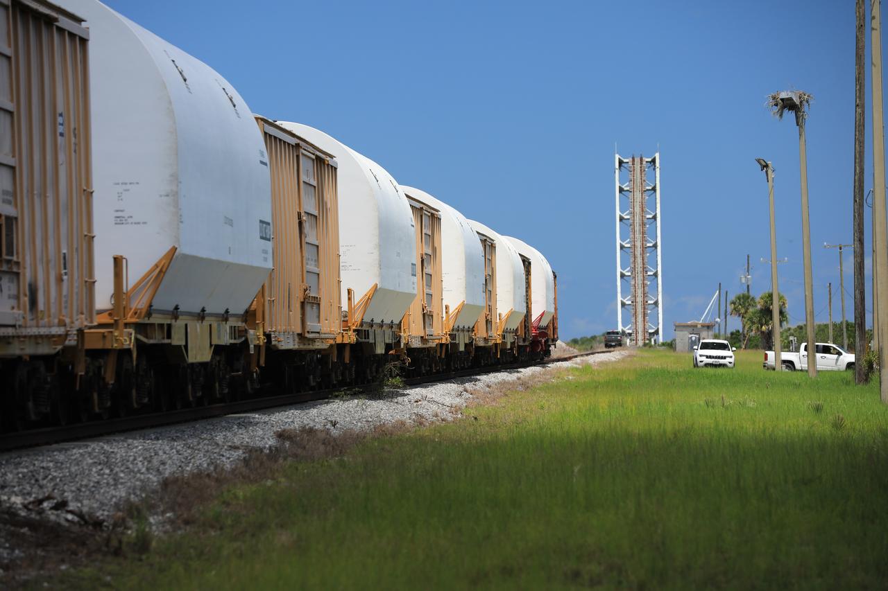 The train carrying the two solid rocket boosters that will power NASA’s Space Launch System (SLS) for Artemis missions to the Moon arrives at the Jay Jay rail yard – the connecting link between Kennedy Space Center and the Florida East Coast railway – in Titusville, Florida, on June 12, 2020. The boosters, each comprised of five motor segments, traveled from a Northrop Grumman manufacturing facility in Promontory, Utah, to Kennedy’s Rotation, Processing and Surge Facility, where teams with NASA’s Exploration Ground Systems will process the segments before moving them to the Vehicle Assembly Building for stacking on the mobile launcher. Under the Artemis program, NASA will land the first woman and the next man on the Moon by 2024. The first in a series of increasingly complex missions, Artemis I will test the Orion spacecraft and SLS as an integrated system ahead of crewed flights to the Moon.  