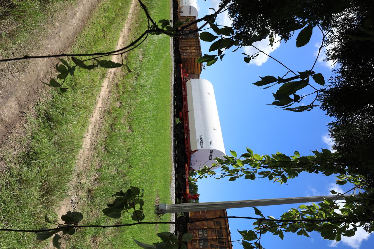 The train carrying the two solid rocket boosters that will power NASA’s Space Launch System (SLS) for Artemis missions to the Moon arrives at the Jay Jay rail yard – the connecting link between Kennedy Space Center and the Florida East Coast railway – in Titusville, Florida, on June 12, 2020. The boosters, each comprised of five motor segments, traveled from a Northrop Grumman manufacturing facility in Promontory, Utah, to Kennedy’s Rotation, Processing and Surge Facility, where teams with NASA’s Exploration Ground Systems will process the segments before moving them to the Vehicle Assembly Building for stacking on the mobile launcher. Under the Artemis program, NASA will land the first woman and the next man on the Moon by 2024. The first in a series of increasingly complex missions, Artemis I will test the Orion spacecraft and SLS as an integrated system ahead of crewed flights to the Moon.  