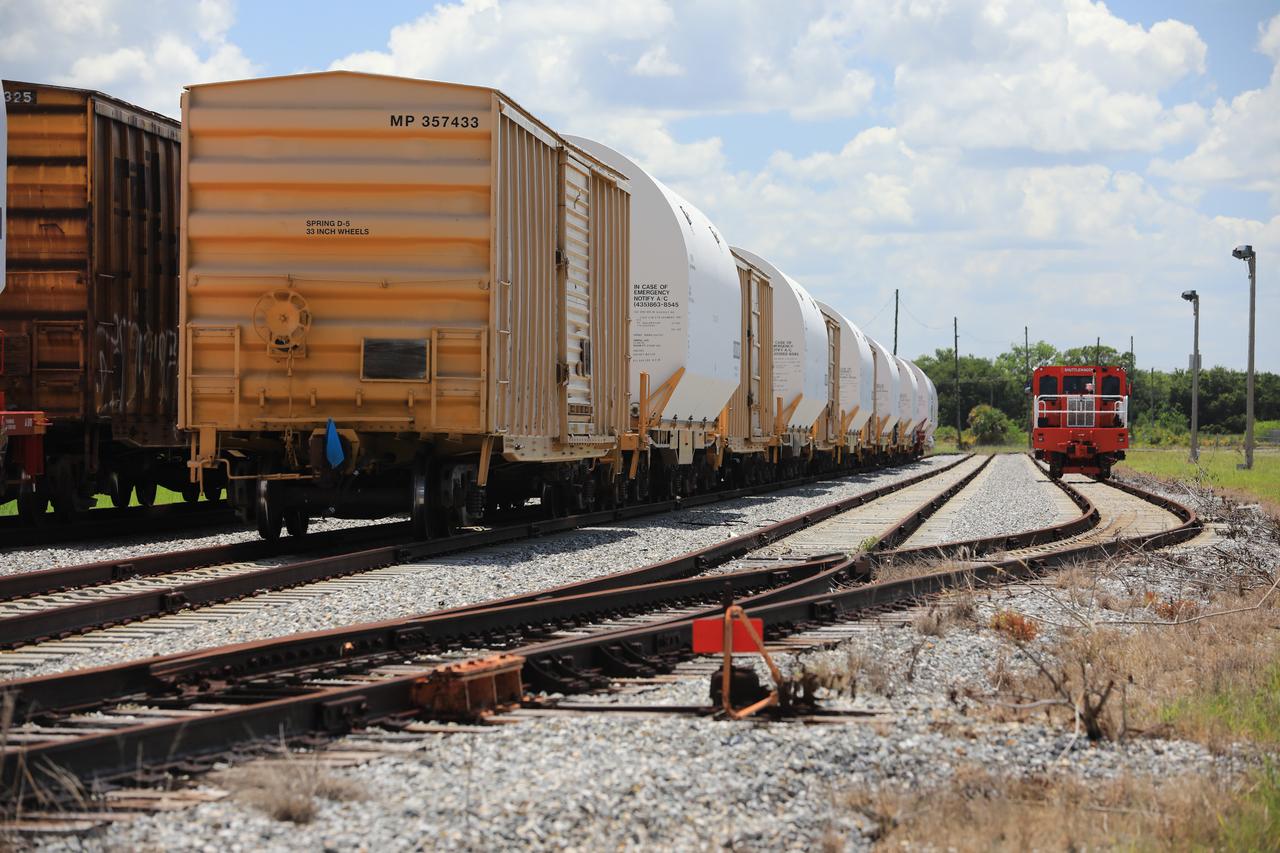 The train carrying the two solid rocket boosters that will power NASA’s Space Launch System (SLS) for Artemis missions to the Moon arrives at the Jay Jay rail yard – the connecting link between Kennedy Space Center and the Florida East Coast railway – in Titusville, Florida, on June 12, 2020. The boosters, each comprised of five motor segments, traveled from a Northrop Grumman manufacturing facility in Promontory, Utah, to Kennedy’s Rotation, Processing and Surge Facility, where teams with NASA’s Exploration Ground Systems will process the segments before moving them to the Vehicle Assembly Building for stacking on the mobile launcher. Under the Artemis program, NASA will land the first woman and the next man on the Moon by 2024. The first in a series of increasingly complex missions, Artemis I will test the Orion spacecraft and SLS as an integrated system ahead of crewed flights to the Moon.  