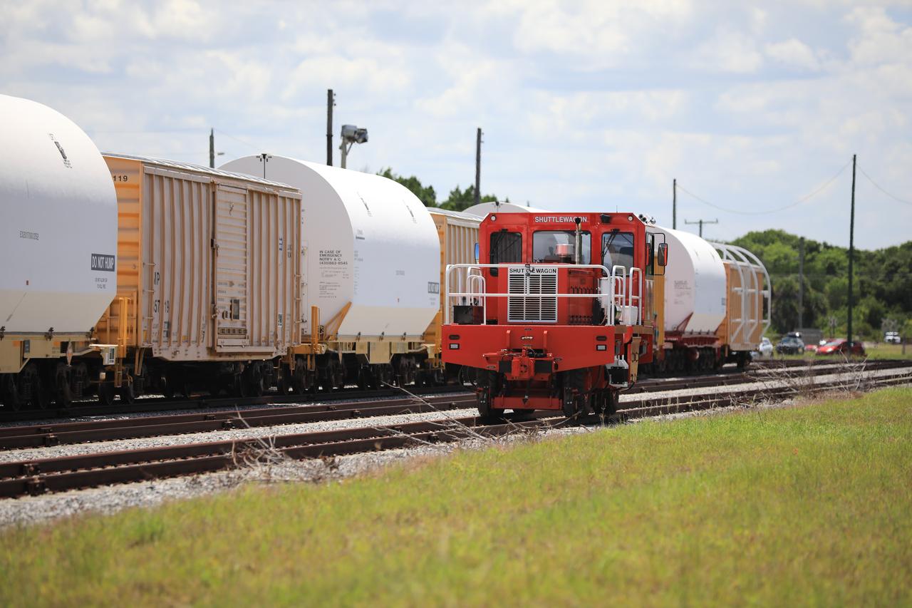 The train carrying the two solid rocket boosters that will power NASA’s Space Launch System (SLS) for Artemis missions to the Moon arrives at the Jay Jay rail yard – the connecting link between Kennedy Space Center and the Florida East Coast railway – in Titusville, Florida, on June 12, 2020. The boosters, each comprised of five motor segments, traveled from a Northrop Grumman manufacturing facility in Promontory, Utah, to Kennedy’s Rotation, Processing and Surge Facility, where teams with NASA’s Exploration Ground Systems will process the segments before moving them to the Vehicle Assembly Building for stacking on the mobile launcher. Under the Artemis program, NASA will land the first woman and the next man on the Moon by 2024. The first in a series of increasingly complex missions, Artemis I will test the Orion spacecraft and SLS as an integrated system ahead of crewed flights to the Moon.  