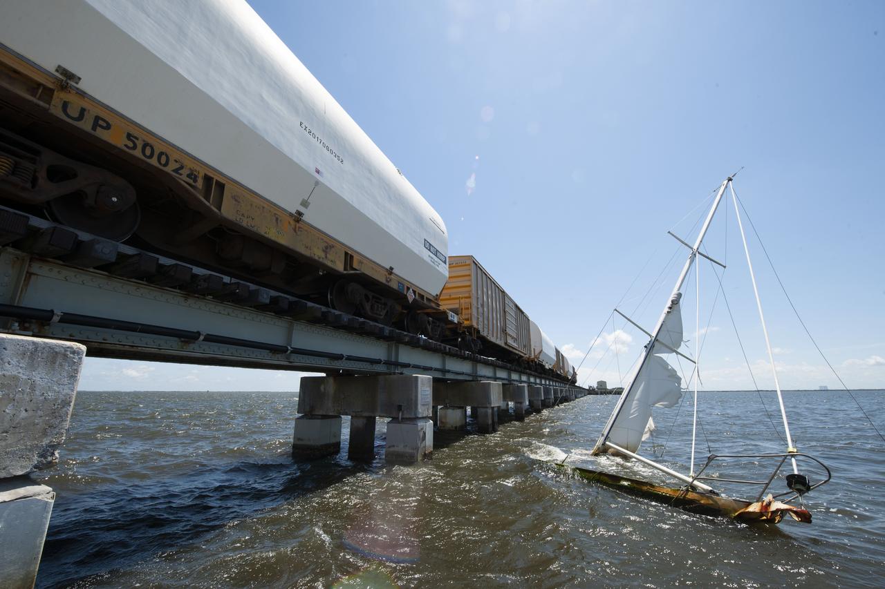 Twin rocket boosters for NASA’s Space Launch System (SLS) that will power Artemis missions to the Moon have arrived at the agency’s Kennedy Space Center in Florida. The two motor segments, each comprised of five segments, arrived at Kennedy’s Rotation, Processing and Surge Facility (RPSF) on June 15, 2020, by train from a Northrop Grumman manufacturing facility in Promontory, Utah. The booster segments will remain in the RPSF for inspection prior to processing until it’s time to move them to the Vehicle Assembly Building for stacking on the mobile launcher. This is the first piece of flight hardware to arrive at Kennedy by train for the Artemis program, but NASA’s Exploration Ground Systems (EGS) can expect to receive additional hardware soon, including the Launch Vehicle Service Adapter and the rocket’s core stage. NASA is working toward an Artemis I launch date in 2021, keeping the program moving at the best possible pace toward the earliest possible opportunity.  