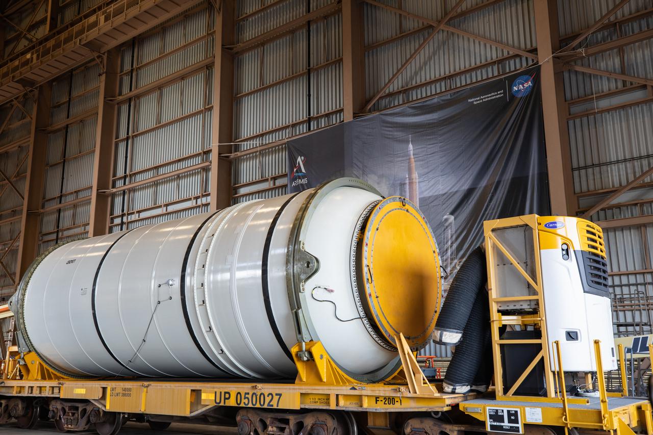 Two NASA Space Launch System (SLS) solid rocket boosters are readied for mating to the rocket’s two aft skirts on June 16, 2020, inside Kennedy Space Center’s Rotation, Processing and Surge Facility. Together, the twin boosters provide more than 75 percent of the total SLS thrust at launch. Manufactured by Northrop Grumman in Promontory, Utah, the boosters arrived at Kennedy via train. The cross-country journey was an important milestone for the agency’s Artemis I launch. The first in a series of increasingly complex missions, Artemis I will test the Orion spacecraft and SLS as an integrated system prior to crewed missions to the Moon. Once the boosters are mated with the aft skirts, they will be moved to the Vehicle Assembly Building for stacking on the mobile launcher.