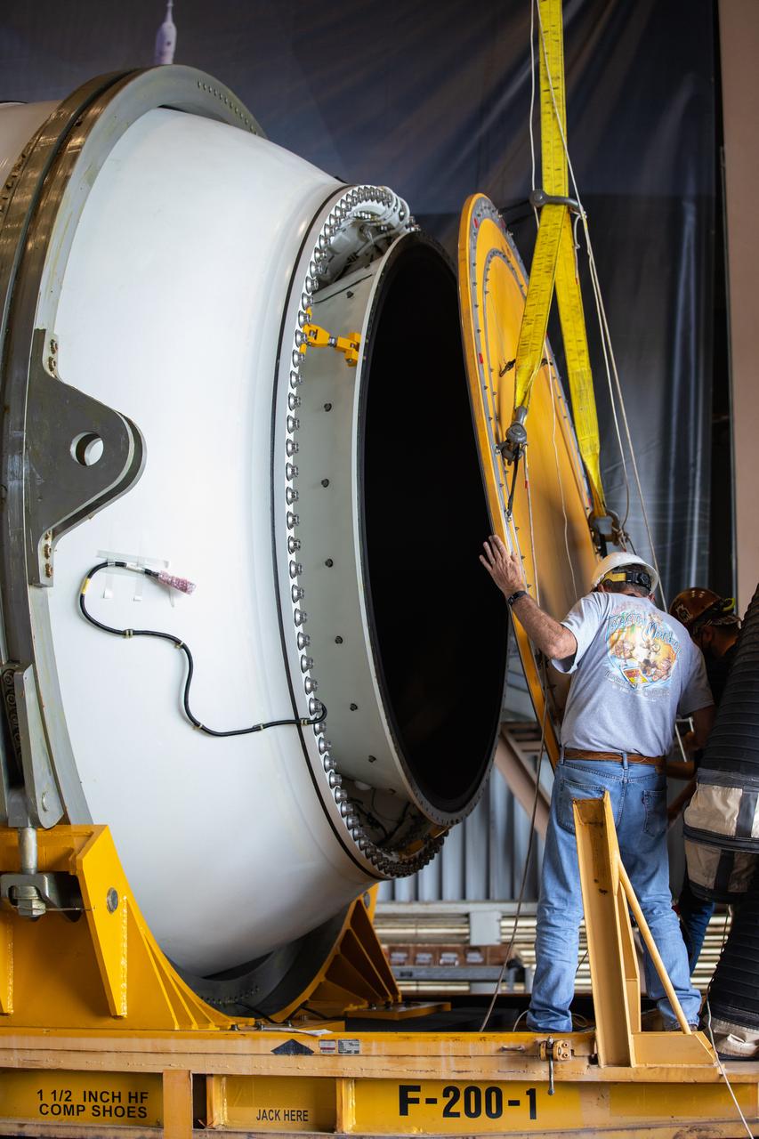Technicians ready two NASA Space Launch System (SLS) solid rocket boosters for mating to the rocket’s two aft skirts on June 16, 2020, inside Kennedy Space Center’s Rotation, Processing and Surge Facility. Together, the twin boosters provide more than 75 percent of the total SLS thrust at launch. Manufactured by Northrop Grumman in Promontory, Utah, the boosters arrived at Kennedy via train. The cross-country journey was an important milestone for the agency’s Artemis I launch. The first in a series of increasingly complex missions, Artemis I will test the Orion spacecraft and SLS as an integrated system prior to crewed missions to the Moon. Once the boosters are mated with the aft skirts, they will be moved to the Vehicle Assembly Building for stacking on the mobile launcher.