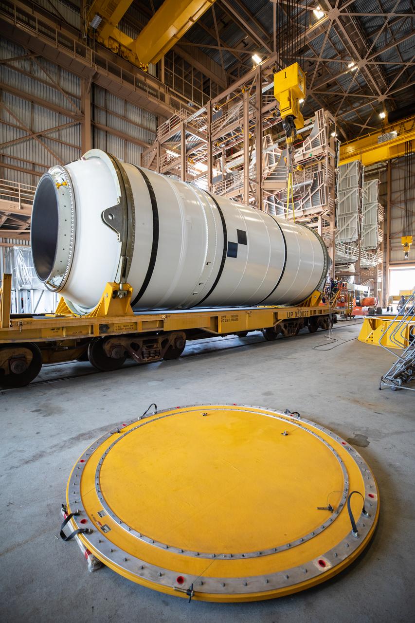 Two NASA Space Launch System (SLS) solid rocket boosters are readied for mating to the rocket’s two aft skirts on June 16, 2020, inside Kennedy Space Center’s Rotation, Processing and Surge Facility. Together, the twin boosters provide more than 75 percent of the total SLS thrust at launch. Manufactured by Northrop Grumman in Promontory, Utah, the boosters arrived at Kennedy via train. The cross-country journey was an important milestone for the agency’s Artemis I launch. The first in a series of increasingly complex missions, Artemis I will test the Orion spacecraft and SLS as an integrated system prior to crewed missions to the Moon. Once the boosters are mated with the aft skirts, they will be moved to the Vehicle Assembly Building for stacking on the mobile launcher.