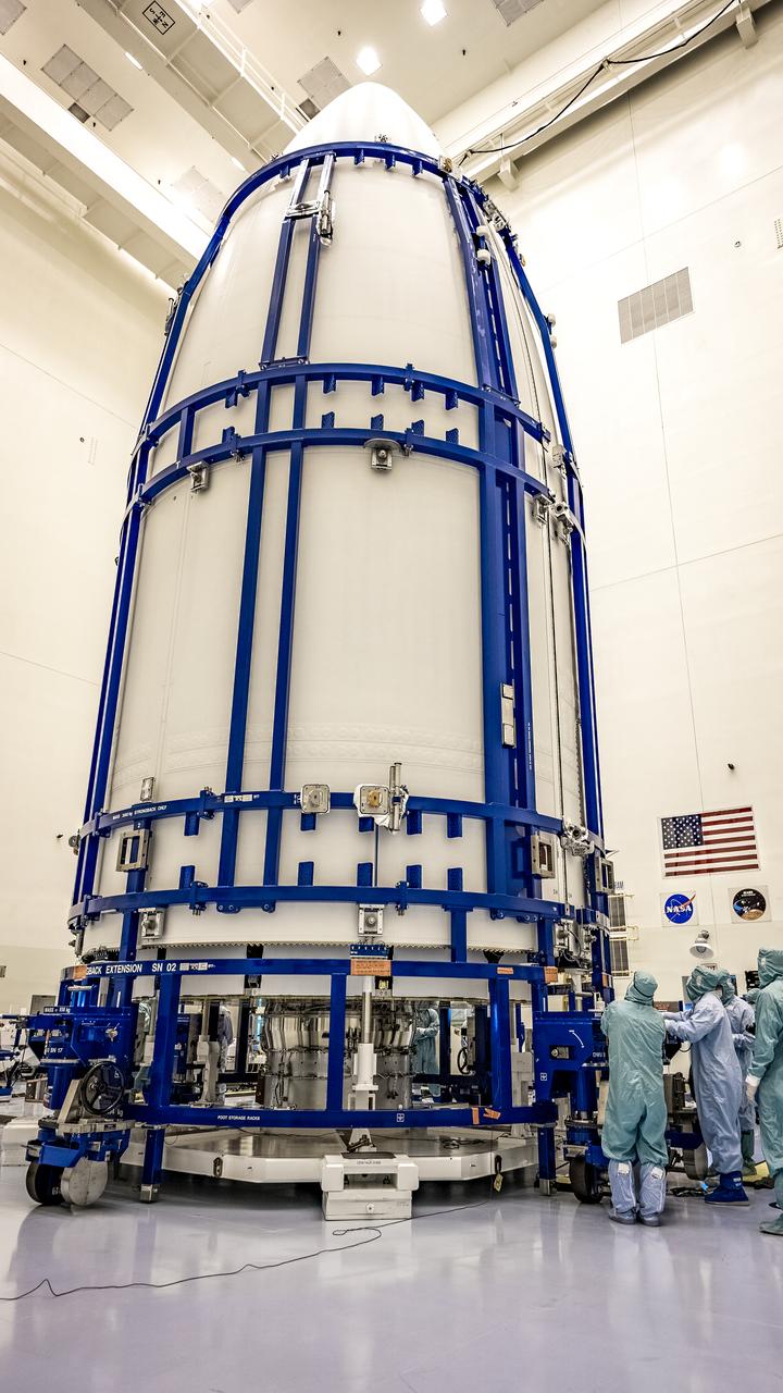 Inside the Payload Hazardous Servicing Facility at NASA’s Kennedy Space Center in Florida, the agency’s Mars 2020 Perseverance rover is encapsulated in the two halves of the United Launch Alliance Atlas V payload fairing on June 18, 2020. The Mars Perseverance rover is scheduled to launch on July 20, 2020, atop the Atlas V rocket from Space Launch Complex 41 at Cape Canaveral Air Force Station. The rover is part of NASA’s Mars Exploration Program, a long-term effort of robotic exploration of the Red Planet. The rover’s seven instruments will search for habitable conditions in the ancient past and signs of past microbial life on Mars. The Launch Services Program at Kennedy is responsible for launch management.