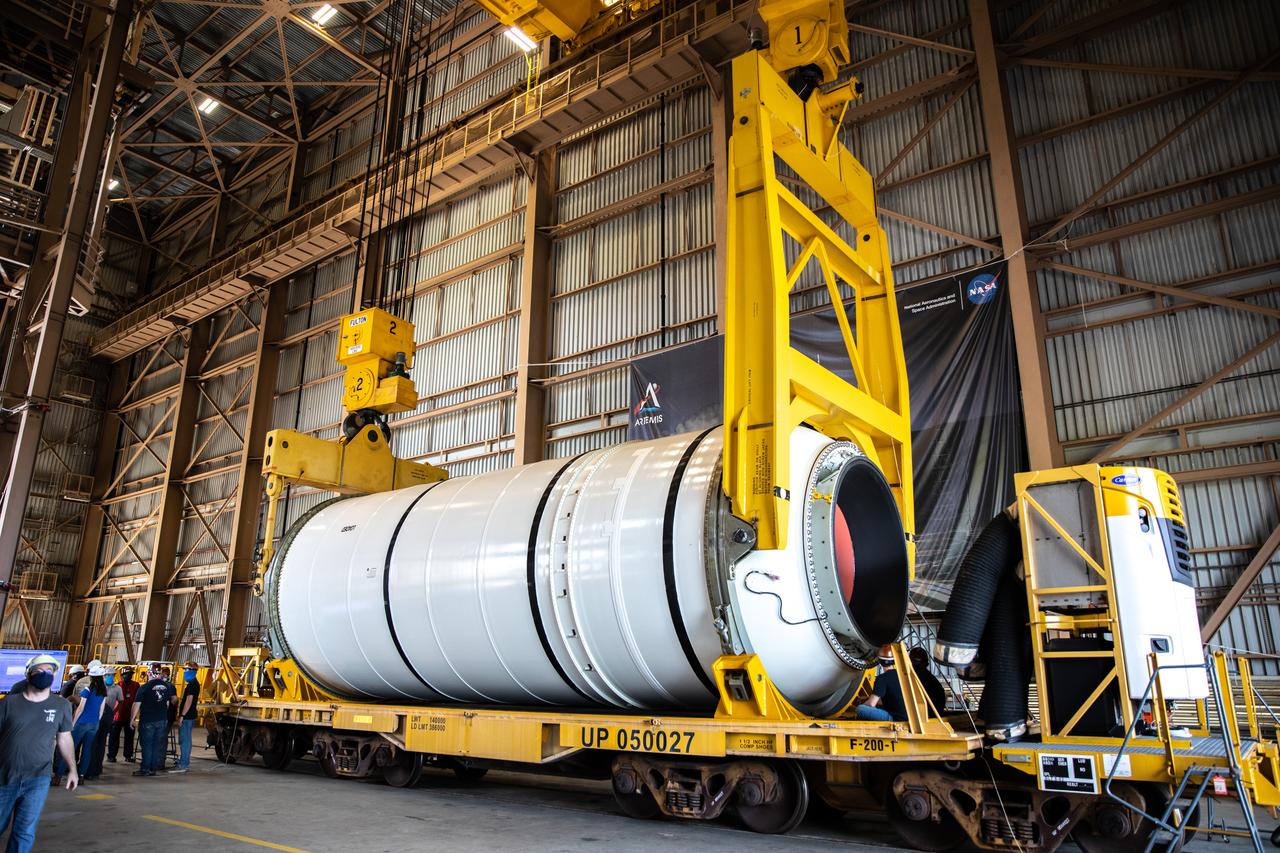 Technicians ready two NASA Space Launch System (SLS) solid rocket boosters for mating to the rocket’s two aft skirts on June 19, 2020, inside Kennedy Space Center’s Rotation, Processing and Surge Facility. Together, the twin boosters provide more than 75 percent of the total SLS thrust at launch. Manufactured by Northrop Grumman in Promontory, Utah, the boosters arrived at Kennedy via train. The cross-country journey was an important milestone for the agency’s Artemis I launch. The first in a series of increasingly complex missions, Artemis I will test the Orion spacecraft and SLS as an integrated system prior to crewed missions to the Moon. Once the boosters are mated with the aft skirts, they will be moved to the Vehicle Assembly Building for stacking on the mobile launcher.