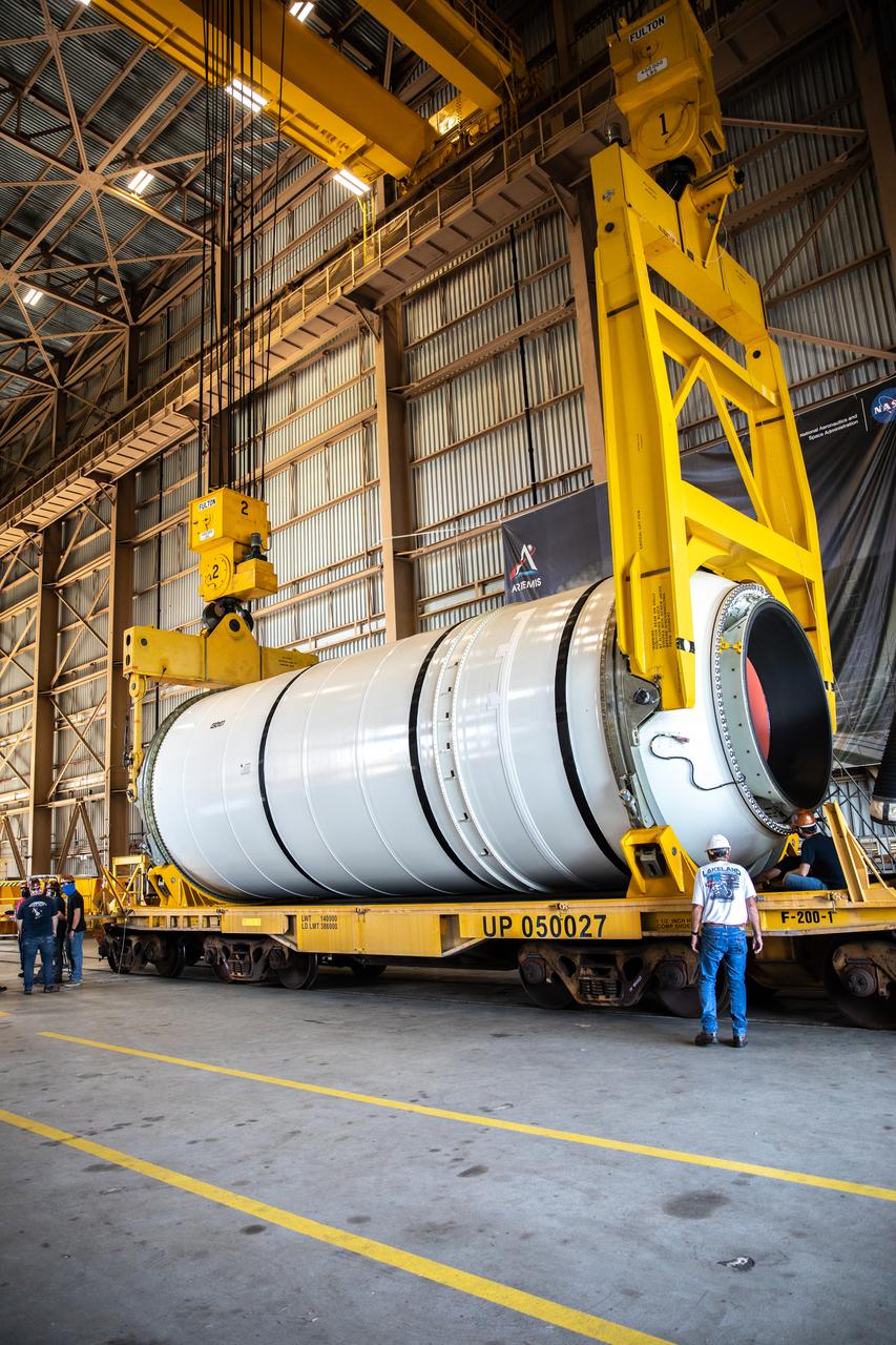 Technicians ready two NASA Space Launch System (SLS) solid rocket boosters for mating to the rocket’s two aft skirts on June 19, 2020, inside Kennedy Space Center’s Rotation, Processing and Surge Facility. Together, the twin boosters provide more than 75 percent of the total SLS thrust at launch. Manufactured by Northrop Grumman in Promontory, Utah, the boosters arrived at Kennedy via train. The cross-country journey was an important milestone for the agency’s Artemis I launch. The first in a series of increasingly complex missions, Artemis I will test the Orion spacecraft and SLS as an integrated system prior to crewed missions to the Moon. Once the boosters are mated with the aft skirts, they will be moved to the Vehicle Assembly Building for stacking on the mobile launcher.