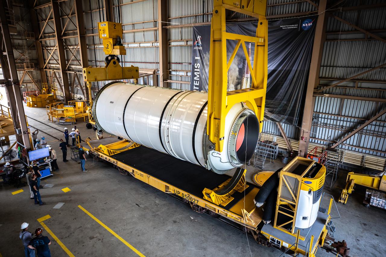 Technicians ready two NASA Space Launch System (SLS) solid rocket boosters for mating to the rocket’s two aft skirts on June 19, 2020, inside Kennedy Space Center’s Rotation, Processing and Surge Facility. Together, the twin boosters provide more than 75 percent of the total SLS thrust at launch. Manufactured by Northrop Grumman in Promontory, Utah, the boosters arrived at Kennedy via train. The cross-country journey was an important milestone for the agency’s Artemis I launch. The first in a series of increasingly complex missions, Artemis I will test the Orion spacecraft and SLS as an integrated system prior to crewed missions to the Moon. Once the boosters are mated with the aft skirts, they will be moved to the Vehicle Assembly Building for stacking on the mobile launcher.
