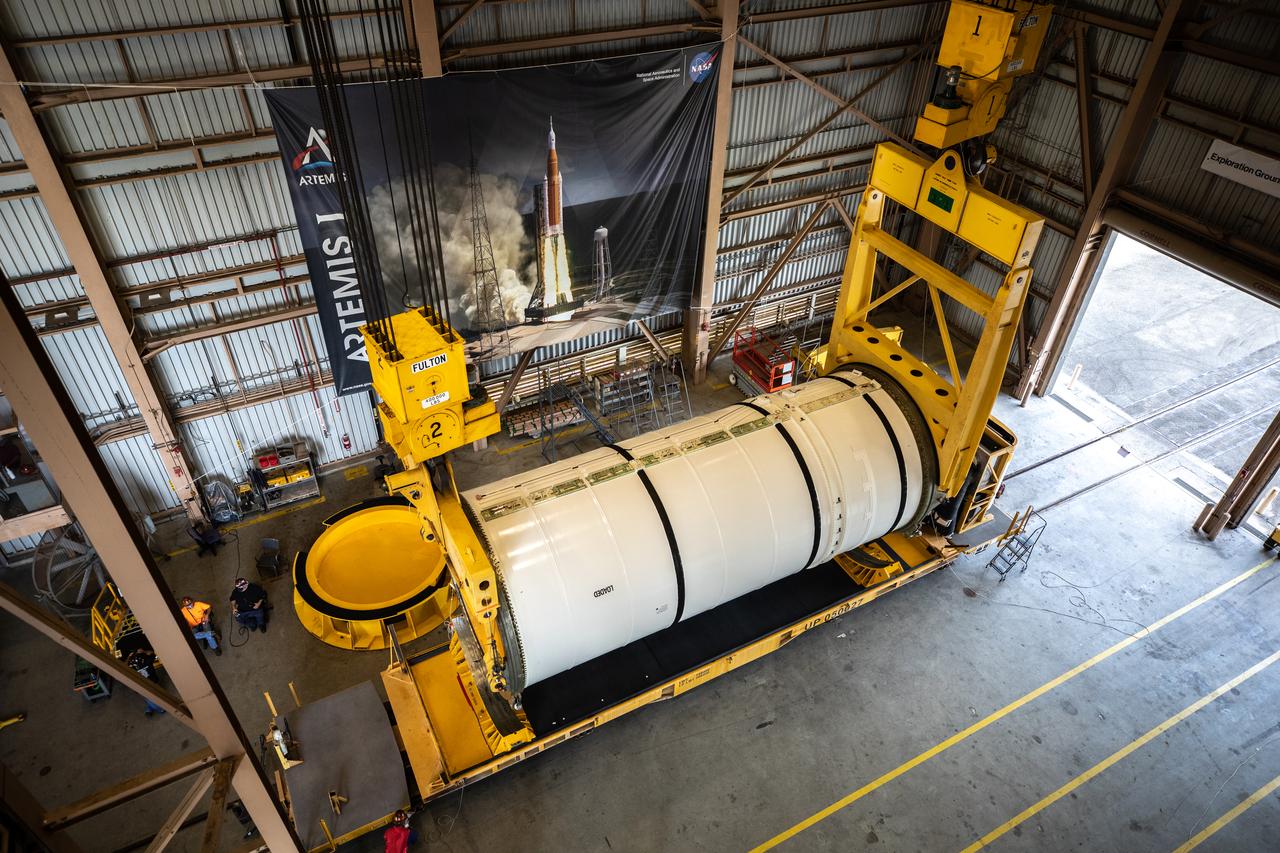 Technicians ready two NASA Space Launch System (SLS) solid rocket boosters for mating to the rocket’s two aft skirts on June 19, 2020, inside Kennedy Space Center’s Rotation, Processing and Surge Facility. Together, the twin boosters provide more than 75 percent of the total SLS thrust at launch. Manufactured by Northrop Grumman in Promontory, Utah, the boosters arrived at Kennedy via train. The cross-country journey was an important milestone for the agency’s Artemis I launch. The first in a series of increasingly complex missions, Artemis I will test the Orion spacecraft and SLS as an integrated system prior to crewed missions to the Moon. Once the boosters are mated with the aft skirts, they will be moved to the Vehicle Assembly Building for stacking on the mobile launcher.