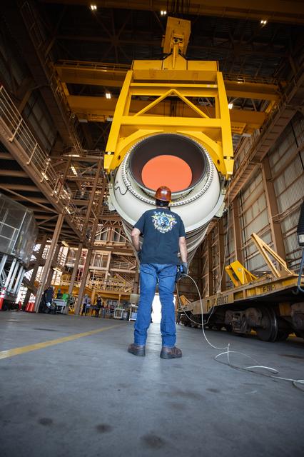 NASA image: Artemis I Booster Segments Lift to Work Stand and Silhouettes
