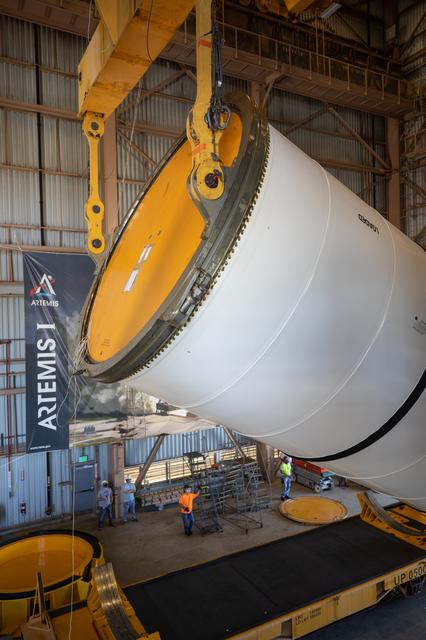 NASA image: Artemis I Booster Segments Lift to Work Stand and Silhouettes