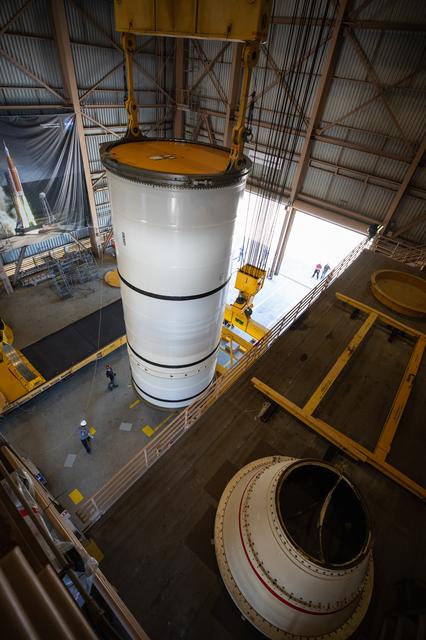 NASA image: Artemis I Booster Segments Lift to Work Stand and Silhouettes