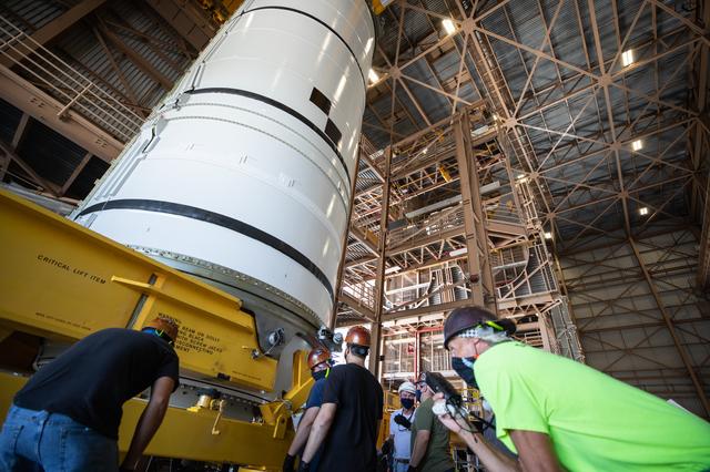 NASA image: Artemis I Booster Segments Lift to Work Stand and Silhouettes