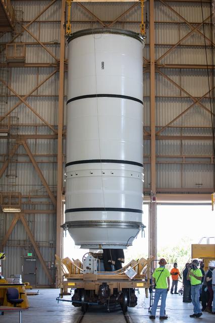 NASA image: Artemis I Booster Segments Lift to Work Stand and Silhouettes