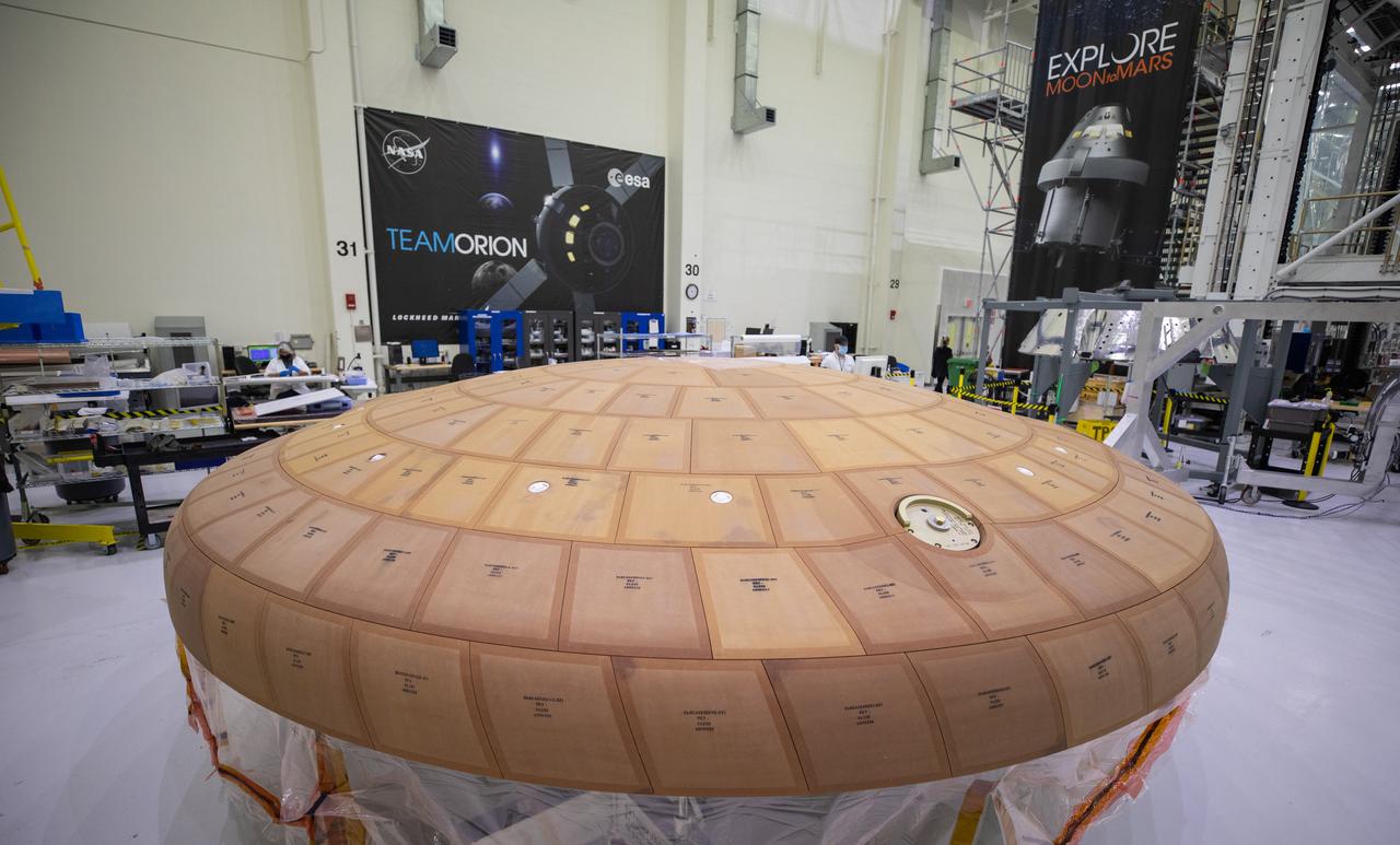 Inside the Neil Armstrong Operations and Checkout Building high bay at NASA's Kennedy Space Center in Florida, the AVCOAT block bonding is complete on the Artemis II heat shield on July 2, 2020. The heat shield is one of the most critical elements of Orion and will protect the capsule and astronauts during reentry through Earth’s atmosphere. Artemis II is the first crewed mission in a series of missions to the Moon and on to Mars. Artemis II will confirm all of the Orion spacecraft’s systems operate as designed in the actual environment of deep space with astronauts aboard. As part of the Artemis Program, NASA will send the first woman and next man to the Moon by 2024.