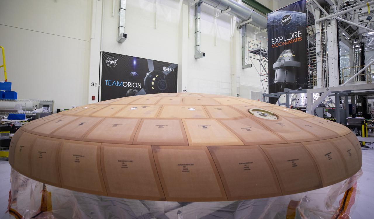 Inside the Neil Armstrong Operations and Checkout Building high bay at NASA's Kennedy Space Center in Florida, the AVCOAT block bonding is complete on the Artemis II heat shield on July 2, 2020. The heat shield is one of the most critical elements of Orion and will protect the capsule and astronauts during reentry through Earth’s atmosphere. Artemis II is the first crewed mission in a series of missions to the Moon and on to Mars. Artemis II will confirm all of the Orion spacecraft’s systems operate as designed in the actual environment of deep space with astronauts aboard. As part of the Artemis Program, NASA will send the first woman and next man to the Moon by 2024. 