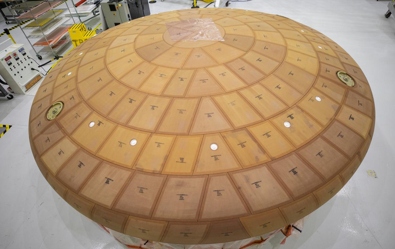 Inside the Neil Armstrong Operations and Checkout Building high bay at NASA's Kennedy Space Center in Florida, the AVOCAT block bonding is complete on the Artemis II heat shield on July 2, 2020. The heat shield is one of the most critical elements of Orion and will protect the capsule and astronauts during reentry through Earth’s atmosphere. Artemis II is the first crewed mission in a series of missions to the Moon and on to Mars. Artemis II will confirm all of the Orion spacecraft’s systems operate as designed in the actual environment of deep space with astronauts aboard. As part of the Artemis Program, NASA will send the first woman and next man to the Moon by 2024.
