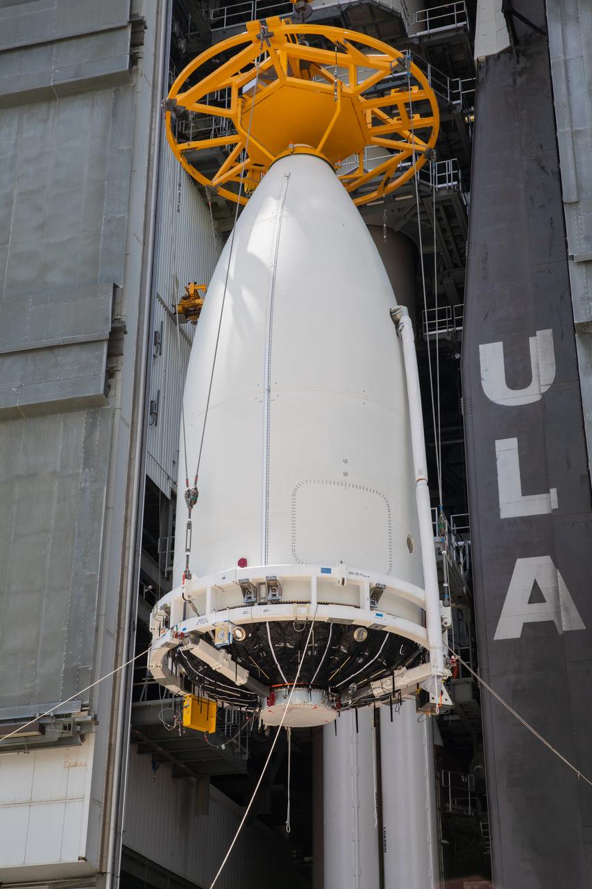 A crane lifts the United Launch Alliance (ULA) payload fairing with NASA’s Mars 2020 Perseverance rover secured inside at the Vertical Integration Facility (VIF) at Space Launch Complex 41 at Cape Canaveral Air Force Station in Florida on July 7, 2020. Inside the VIF, the payload fairing will be secured on the ULA Atlas V rocket. The Mars Perseverance rover is scheduled to launch atop the Atlas V 541 rocket from Pad 41 on July 30. The rover is part of NASA’s Mars Exploration Program, a long-term effort of robotic exploration of the Red Planet. The rover’s seven instruments will search for habitable conditions in the ancient past and signs of past microbial life on Mars. The Launch Services Program at Kennedy is responsible for launch management.