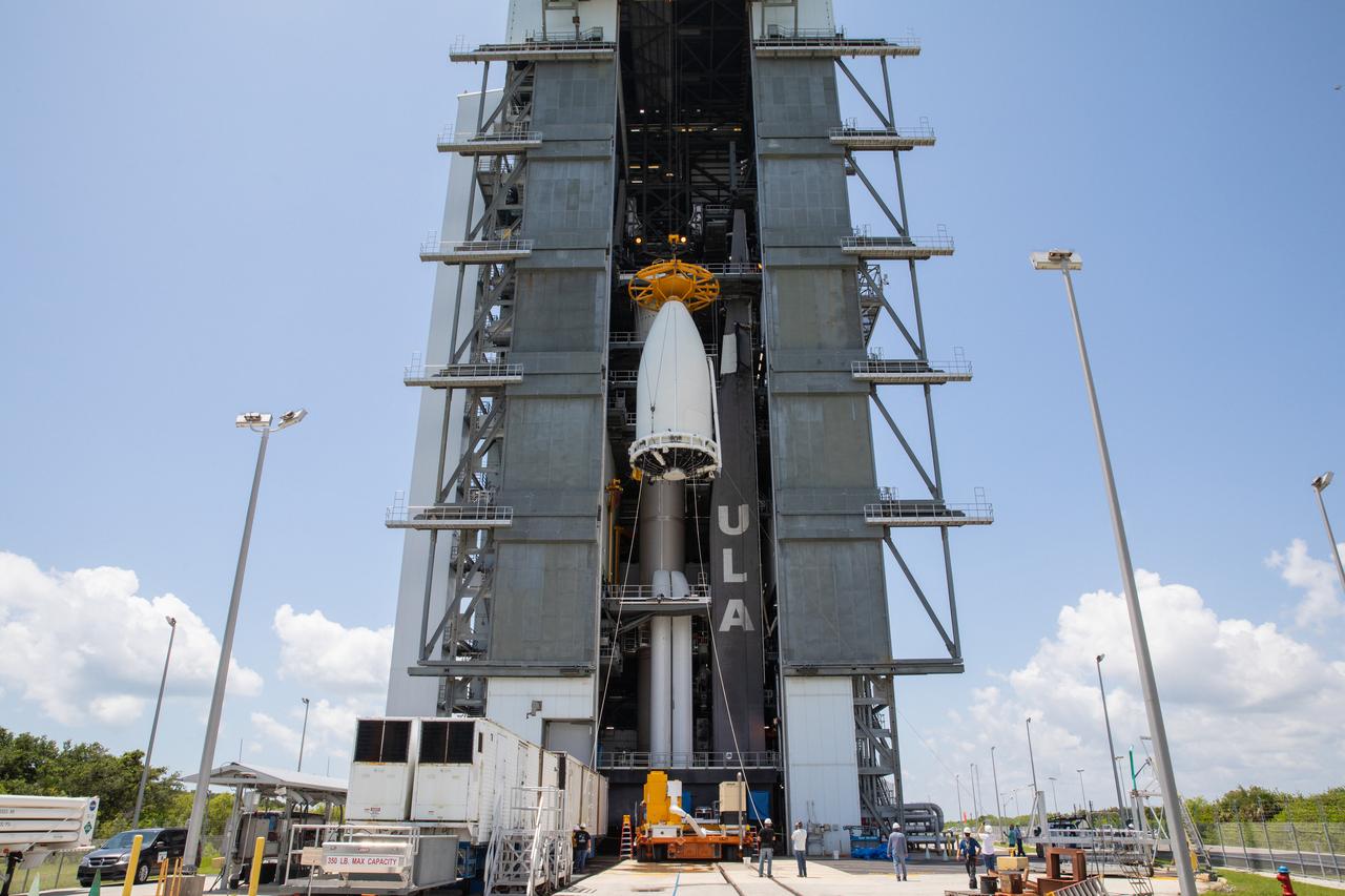 A crane lifts the United Launch Alliance (ULA) payload fairing with NASA’s Mars 2020 Perseverance rover secured inside at the Vertical Integration Facility (VIF) at Space Launch Complex 41 at Cape Canaveral Air Force Station in Florida on July 7, 2020. Inside the VIF, the payload fairing will be secured on the ULA Atlas V rocket. The Mars Perseverance rover is scheduled to launch atop the Atlas V 541 rocket from Pad 41 on July 30. The rover is part of NASA’s Mars Exploration Program, a long-term effort of robotic exploration of the Red Planet. The rover’s seven instruments will search for habitable conditions in the ancient past and signs of past microbial life on Mars. The Launch Services Program at Kennedy is responsible for launch management.