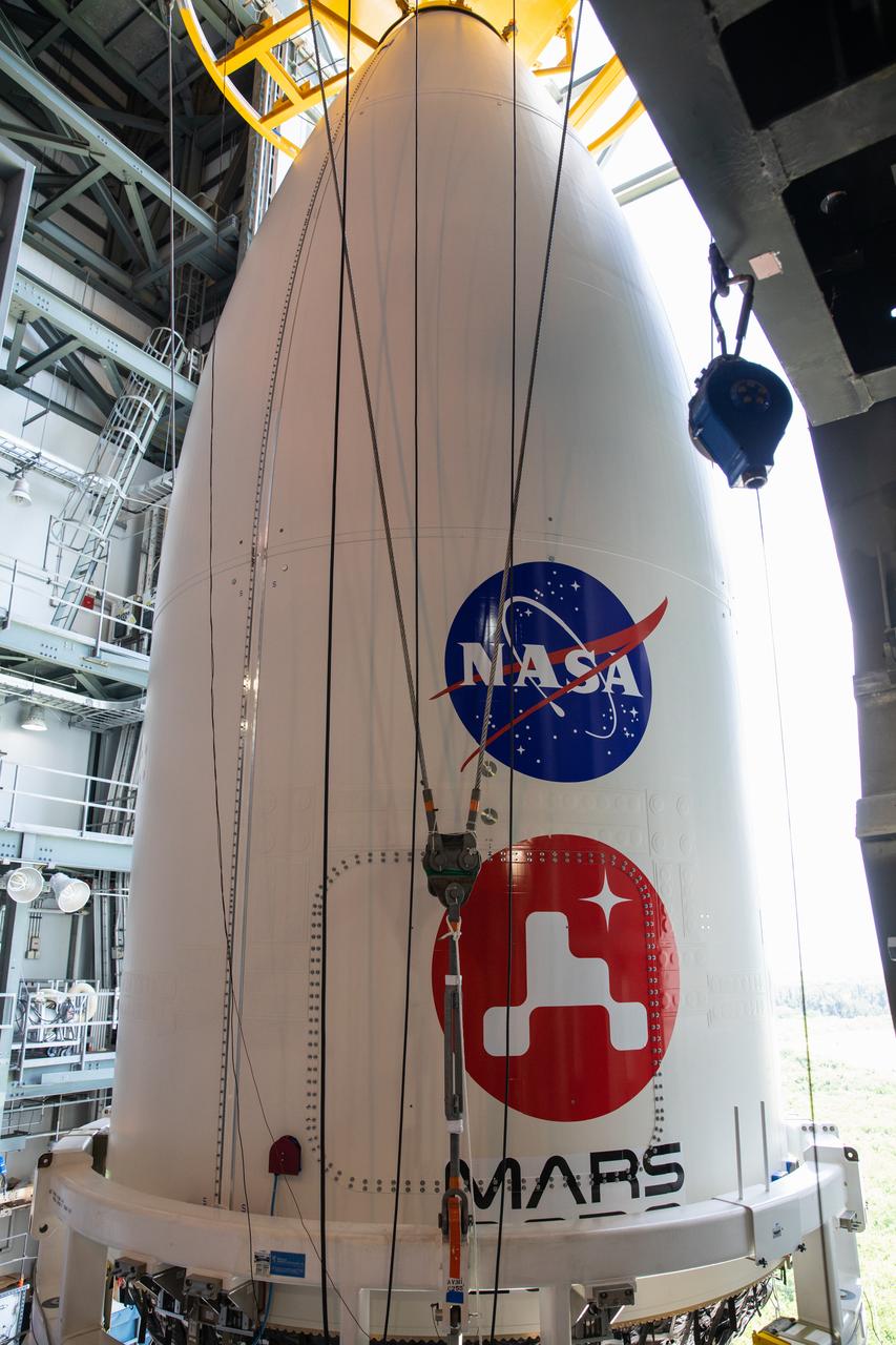 The United Launch Alliance (ULA) payload fairing with NASA’s Mars 2020 Perseverance rover secured inside is positioned on top of the ULA Atlas V rocket inside the Vertical Integration Facility (VIF) at Space Launch Complex 41 at Cape Canaveral Air Force Station in Florida on July 7, 2020. The payload fairing will be secured on the ULA Atlas V rocket. The Mars Perseverance rover is scheduled to launch atop the Atlas V 541 rocket from Pad 41 on July 30. The rover is part of NASA’s Mars Exploration Program, a long-term effort of robotic exploration of the Red Planet. The rover’s seven instruments will search for habitable conditions in the ancient past and signs of past microbial life on Mars. The Launch Services Program at Kennedy is responsible for launch management.