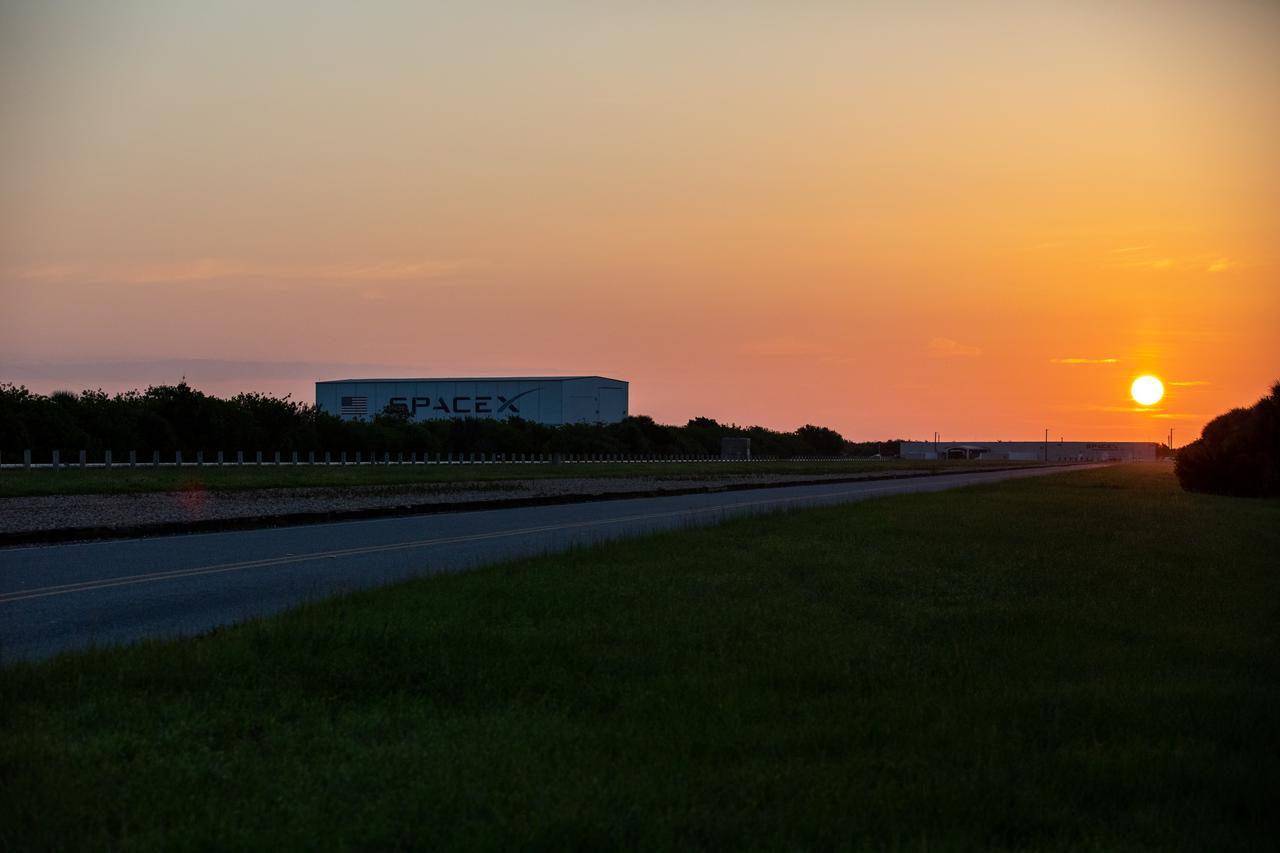 A magnificent sunrise is captured over SpaceX’s processing facility at NASA’s Kennedy Space Center in Florida on July 15, 2020. Under the agency’s Commercial Crew Program, NASA and SpaceX have returned human spaceflight capability to the U.S. NASA astronauts Robert Behnken and Douglas Hurley launched to the International Space Station on May 30, 2020, for the agency’s SpaceX Demo-2 mission, becoming the first time astronauts had launched from American soil since 2011. The mission, concluding on Aug. 2 with Behnken and Hurley’s safe return to Earth, was the final flight test for SpaceX under the program, paving the way for NASA to fully certify the company’s crew transportation for rotational missions to the orbiting laboratory.