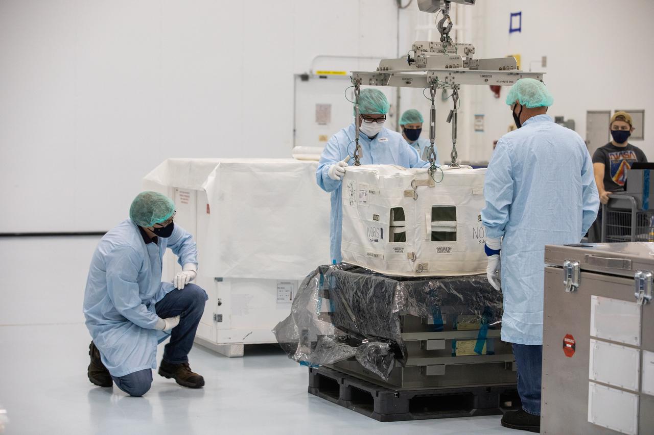 Technicians unpack and inspect a Nitrogen/Oxygen Recharge System (NORS) tank inside the Space Station Processing Facility high bay at NASA’s Kennedy Space Center in Florida on July 16, 2020. The NORS tanks and their support fixtures are designed to connect to the International Space Station’s existing air supply network to refill the previous generation of tanks installed during construction of the space station. These reusable tanks measure 3 feet long and 21 inches in diameter, and weigh about 200 pounds when filled. Once onboard, the tanks will be used to fill the oxygen and nitrogen tanks that supply the needed gases to the space station’s airlock for spacewalks. They could also be used to replenish the atmosphere inside the station. The NORS tanks will launch to the station later in the year on a commercial resupply mission.