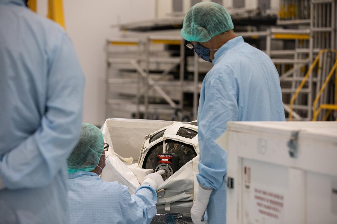 Technicians unpack and inspect a Nitrogen/Oxygen Recharge System (NORS) tank inside the Space Station Processing Facility high bay at NASA’s Kennedy Space Center in Florida on July 16, 2020. The NORS tanks and their support fixtures are designed to connect to the International Space Station’s existing air supply network to refill the previous generation of tanks installed during construction of the space station. These reusable tanks measure 3 feet long and 21 inches in diameter, and weigh about 200 pounds when filled. Once onboard, the tanks will be used to fill the oxygen and nitrogen tanks that supply the needed gases to the space station’s airlock for spacewalks. They could also be used to replenish the atmosphere inside the station. The NORS tanks will launch to the station later in the year on a commercial resupply mission.