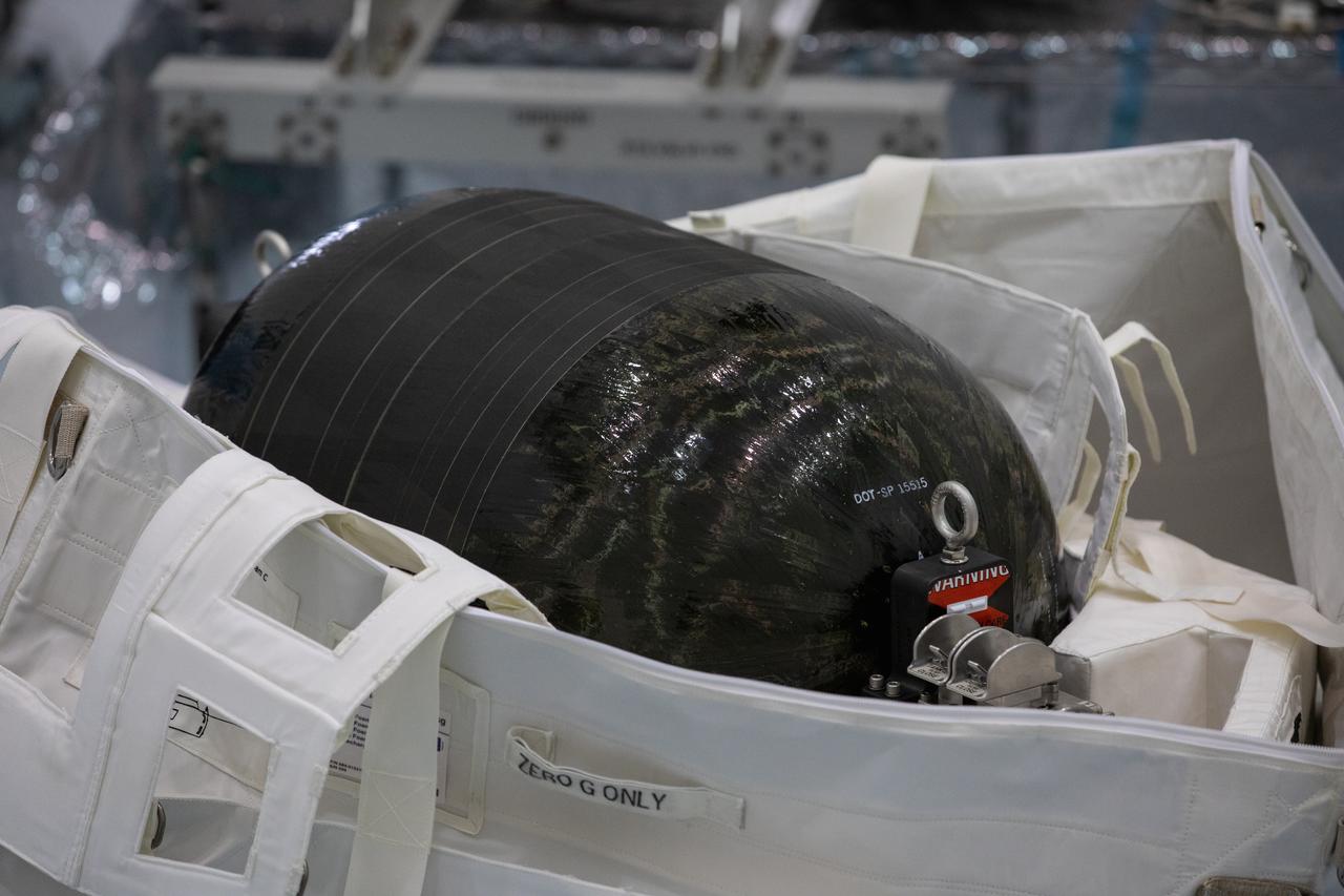A Nitrogen/Oxygen Recharge System (NORS) tank is unpacked and readied for inspection inside the Space Station Processing Facility high bay at NASA’s Kennedy Space Center in Florida on July 16, 2020. The NORS tanks and their support fixtures are designed to connect to the International Space Station’s existing air supply network to refill the previous generation of tanks installed during construction of the space station. These reusable tanks measure 3 feet long and 21 inches in diameter, and weigh about 200 pounds when filled. Once onboard, the tanks will be used to fill the oxygen and nitrogen tanks that supply the needed gases to the space station’s airlock for spacewalks. They could also be used to replenish the atmosphere inside the station. The NORS tanks will launch to the station later in the year on a commercial resupply mission.