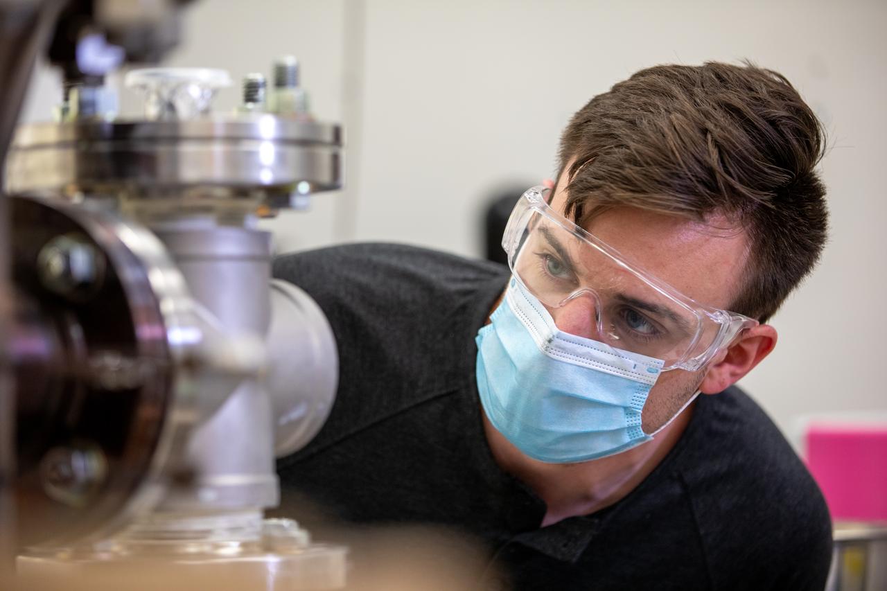 Kevin Grossman, project lead for the Gaseous Lunar Oxygen from Regolith Electrolysis (GaLORE) project at NASA Kennedy Space Center’s Swamp Works, works on the hardware for GaLORE on July 21, 2020, inside a laboratory at the center’s Neil Armstrong Operations and Checkout Building. Grossman is leading an Early Career Initiative project that is investing in turning lunar regolith into oxygen that could be used for life support for sustainable human lunar exploration on long-duration missions to Mars. GaLORE was selected as an Early Career Initiative project by NASA’s Space Technology Mission directorate.