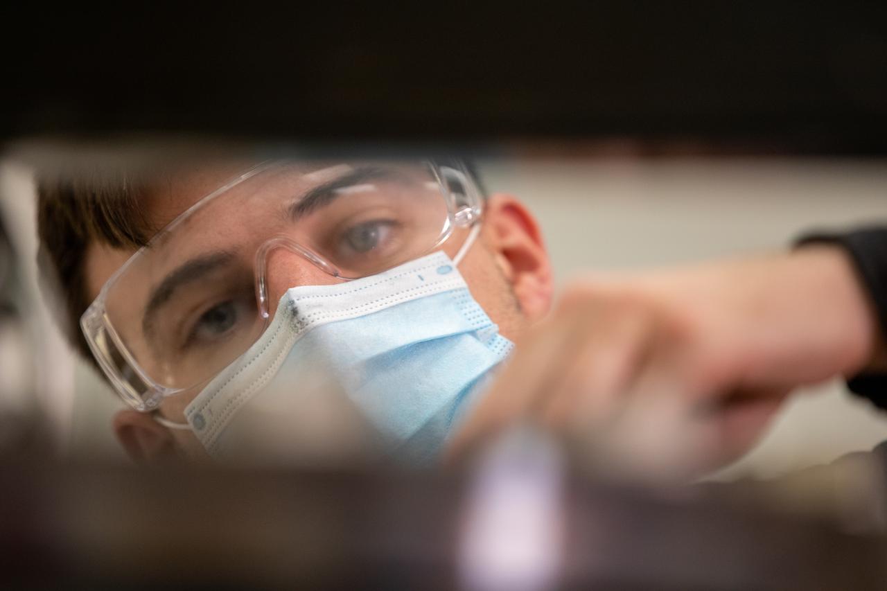 Kevin Grossman, project lead for the Gaseous Lunar Oxygen from Regolith Electrolysis (GaLORE) project at NASA Kennedy Space Center’s Swamp Works, works on the hardware for GaLORE on July 21, 2020, inside a laboratory at the center’s Neil Armstrong Operations and Checkout Building. Grossman is leading an Early Career Initiative project that is investing in turning lunar regolith into oxygen that could be used for life support for sustainable human lunar exploration on long-duration missions to Mars. GaLORE was selected as an Early Career Initiative project by NASA’s Space Technology Mission directorate.