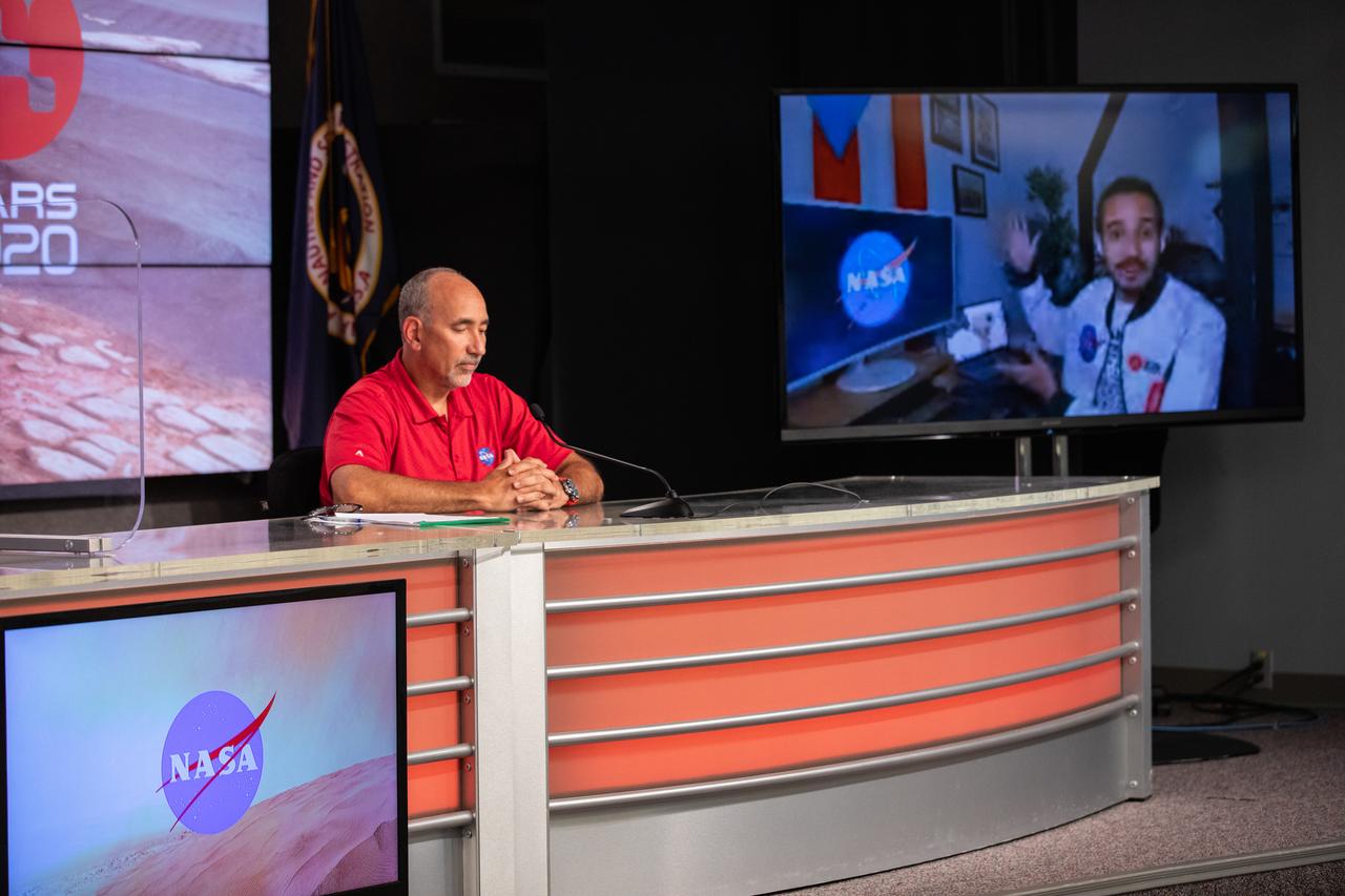 Elio Morillo, a Mars 2020 system testbed engineer from NASA’s Jet Propulsion Laboratory, speaks remotely while Albert Sierra, NASA’s Launch Services Program (LSP) chief of Flight Projects Office, listens during a “Mars 2020 Social Media Q&A: En Español” program on Wednesday, July 22, at NASA’s Kennedy Space Center in Florida. The event featured representatives from LSP and NASA’s Jet Propulsion Laboratory. The Mars Perseverance rover is scheduled to lift off aboard a United Launch Alliance Atlas V 541 rocket from Cape Canaveral Air Force Station’s Space Launch Complex 41 on Thursday, July 30. The two-hour window opens at 7:50 a.m. EDT. LSP, based at Kennedy, is managing the launch.